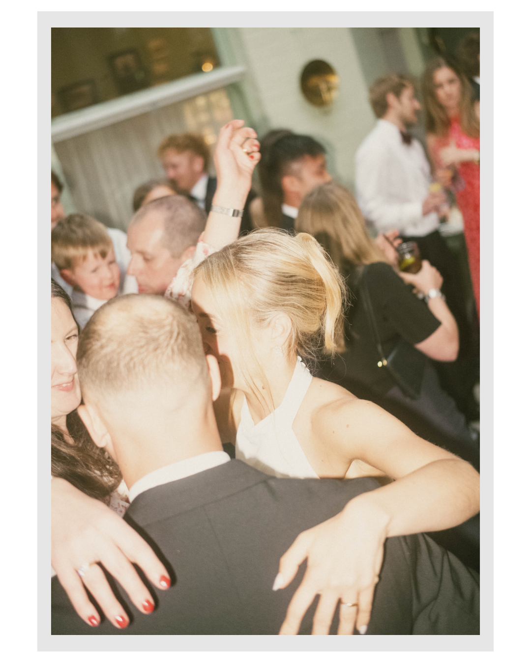 People dancing and socializing at a party or celebration.