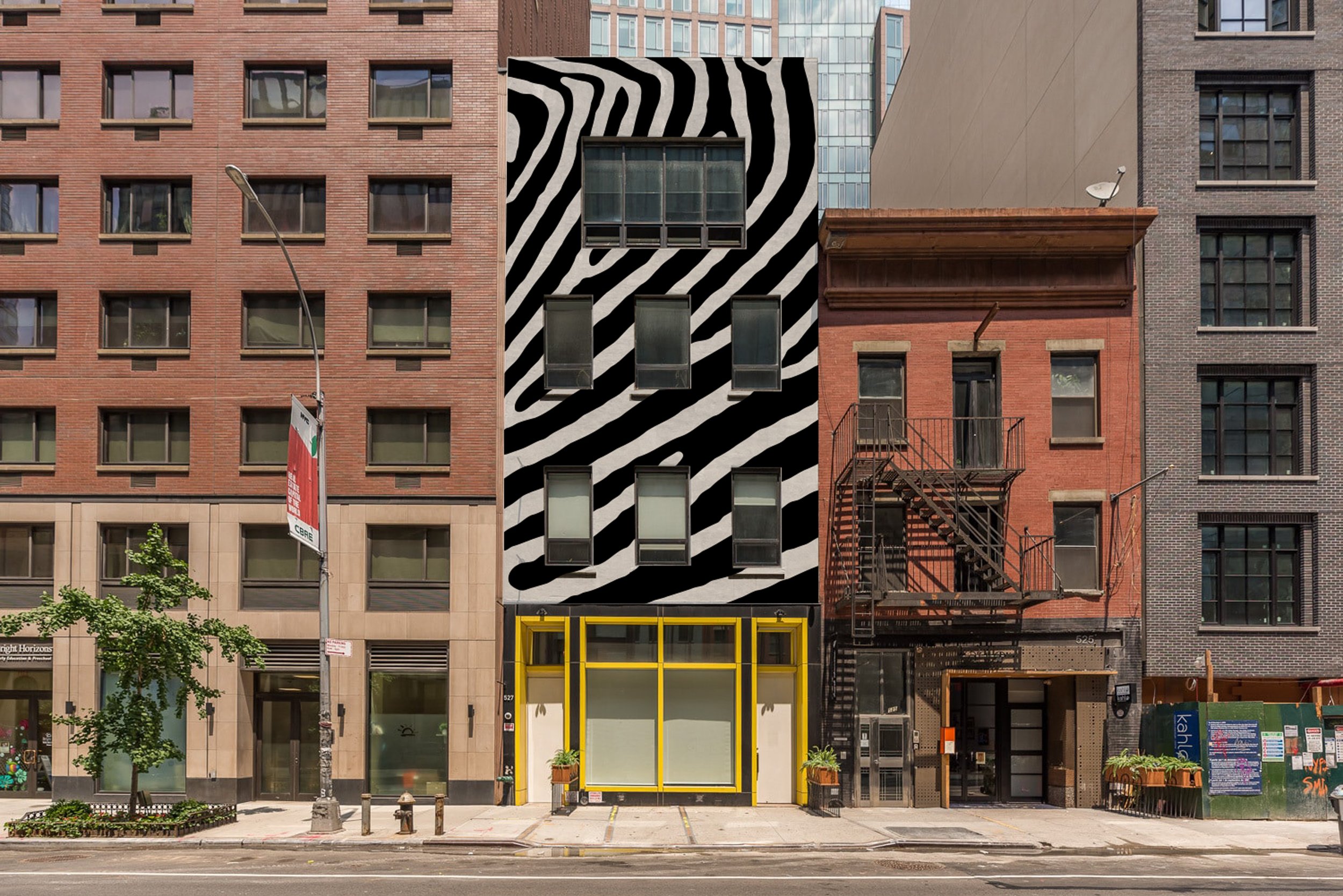 The Zebra Building rendering in front of West 29th St, looking north toward the top of the street. Original photo taken in early 2020s. Digitally altered, and will be updated with a real-life photo when the painting is done.