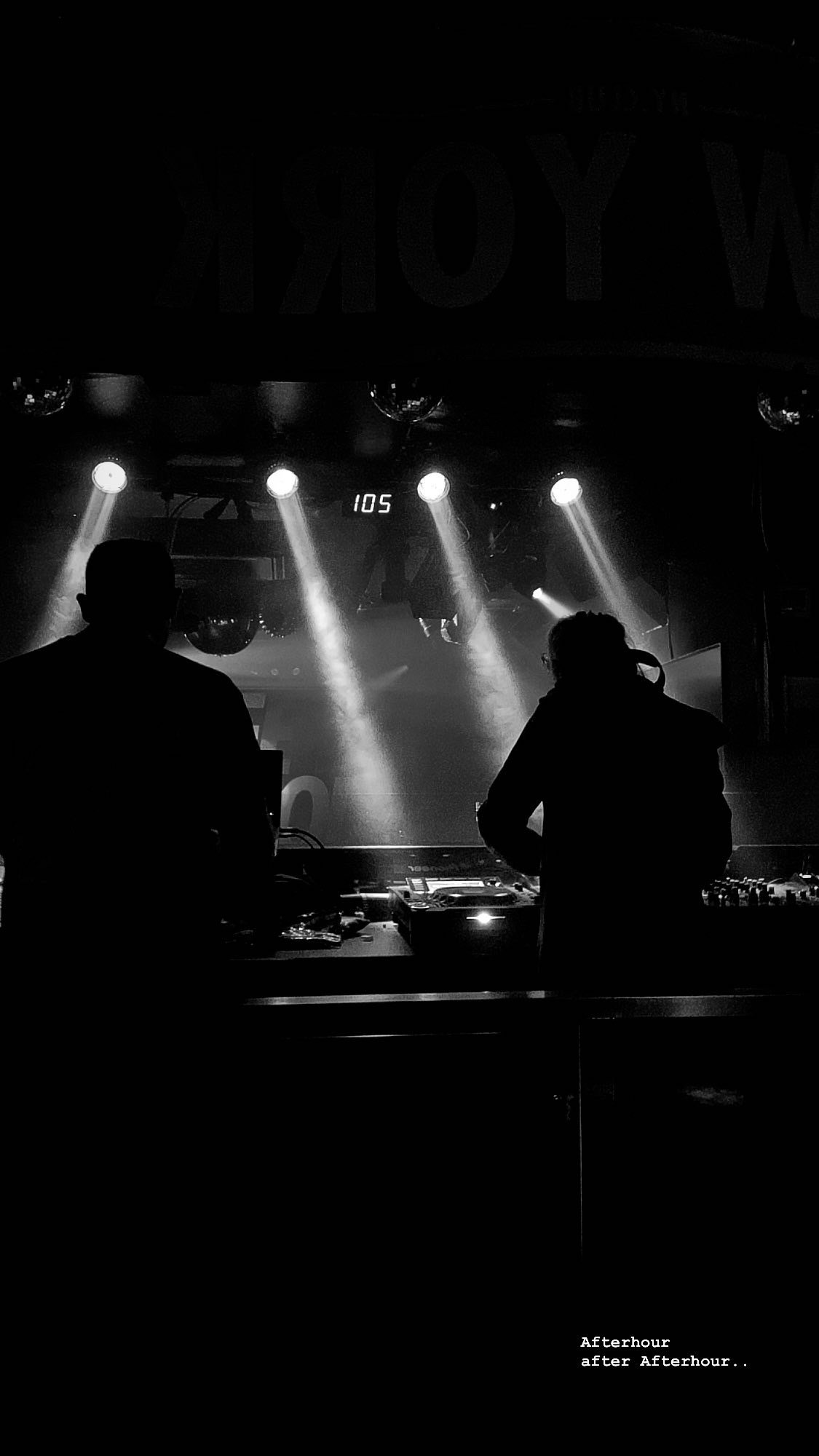 Silhouettes of two DJs performing in a dark club with spotlights, a digital clock showing 1:05, and a partial sign reading 'SHOW' at the top, with the words 'Afterhour after Afterhour..' at the bottom.