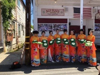 Vietnamese American woman dance troupe at the Locke Spring Festival 2026, in front of Al's Place restaurant.