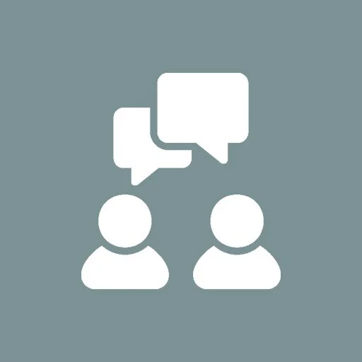 Two simplified human icons with speech bubbles indicating communication or conversation.
