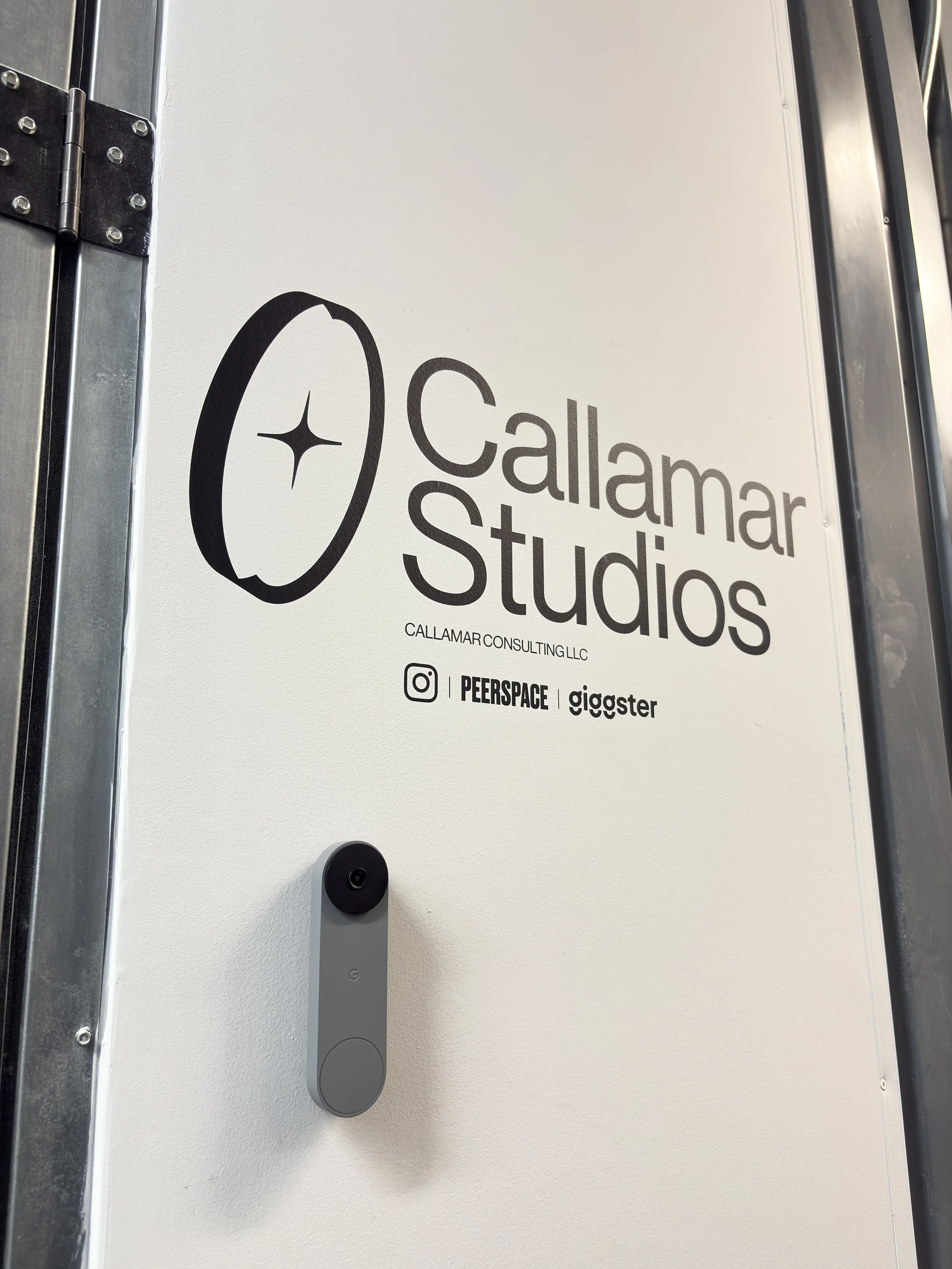 Sign that reads 'Callamar Studios' with logo and contact information.