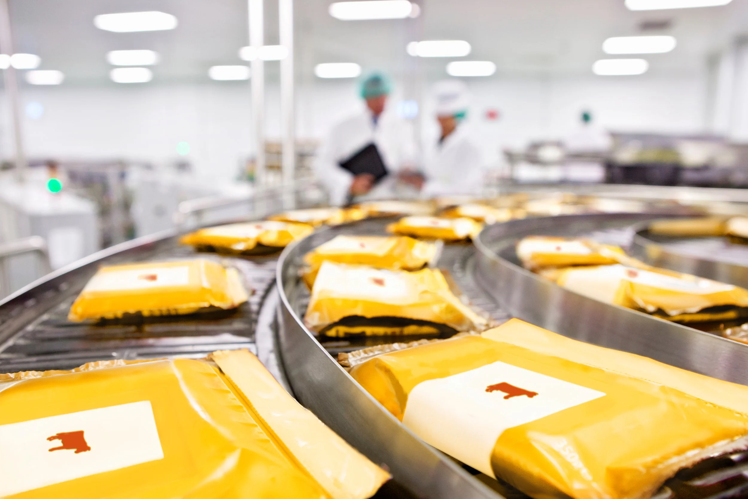 cow-labels-on-packages-of-cheese-on-conveyor-belt.jpg