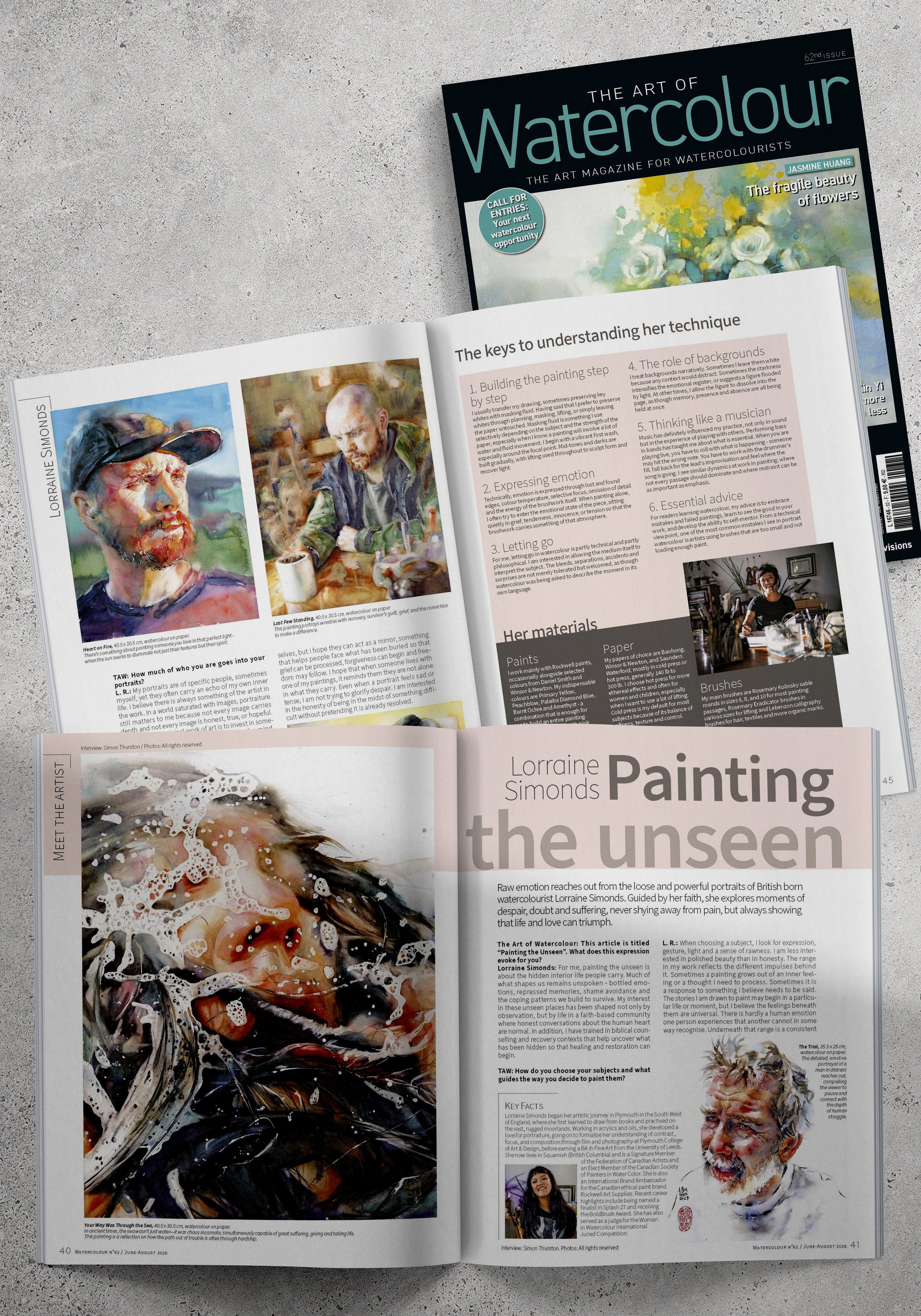 Open magazine titled "The Art of Watercolour" featuring artwork and articles about watercolor painting, with images of watercolor portraits and an artist at work.