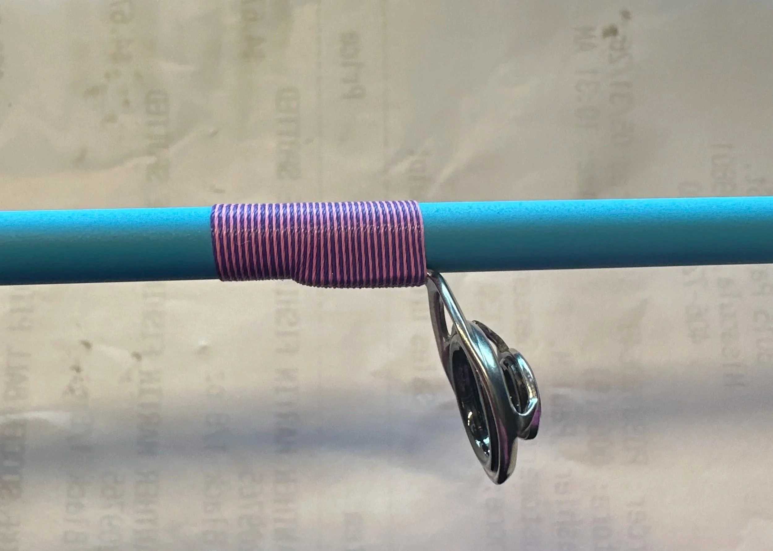 pink and purple custom thread wrap on a bfs rod