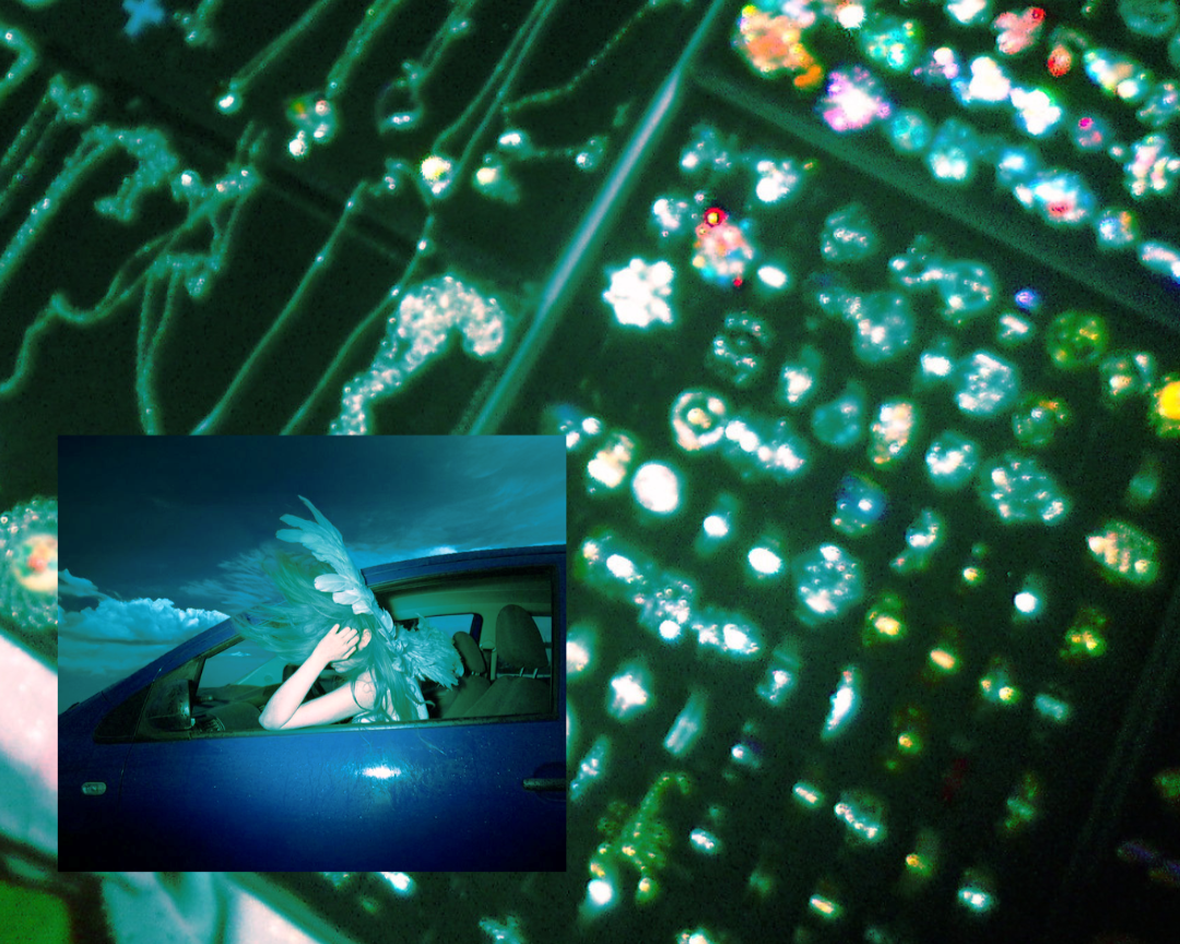 Main image: Close-up of shiny, colorful, glittering objects, possibly sequins or crystals. Insert: Person with long, flowing hair and large feathered wings sitting in the driver's seat of a car, with a background of clouds and blue sky.