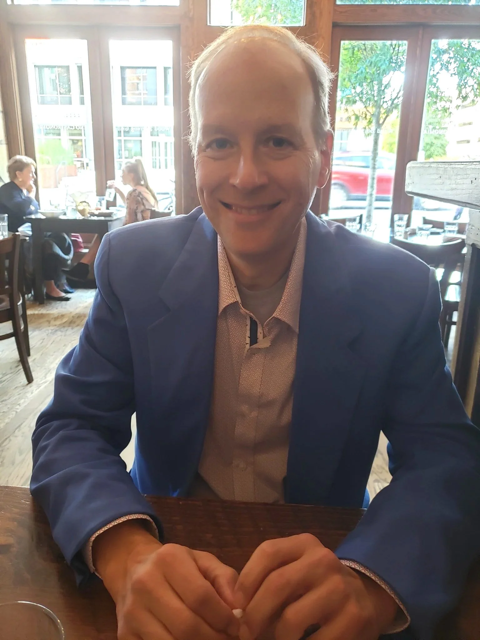 Barclay R. Brown smiling at a restaurant table