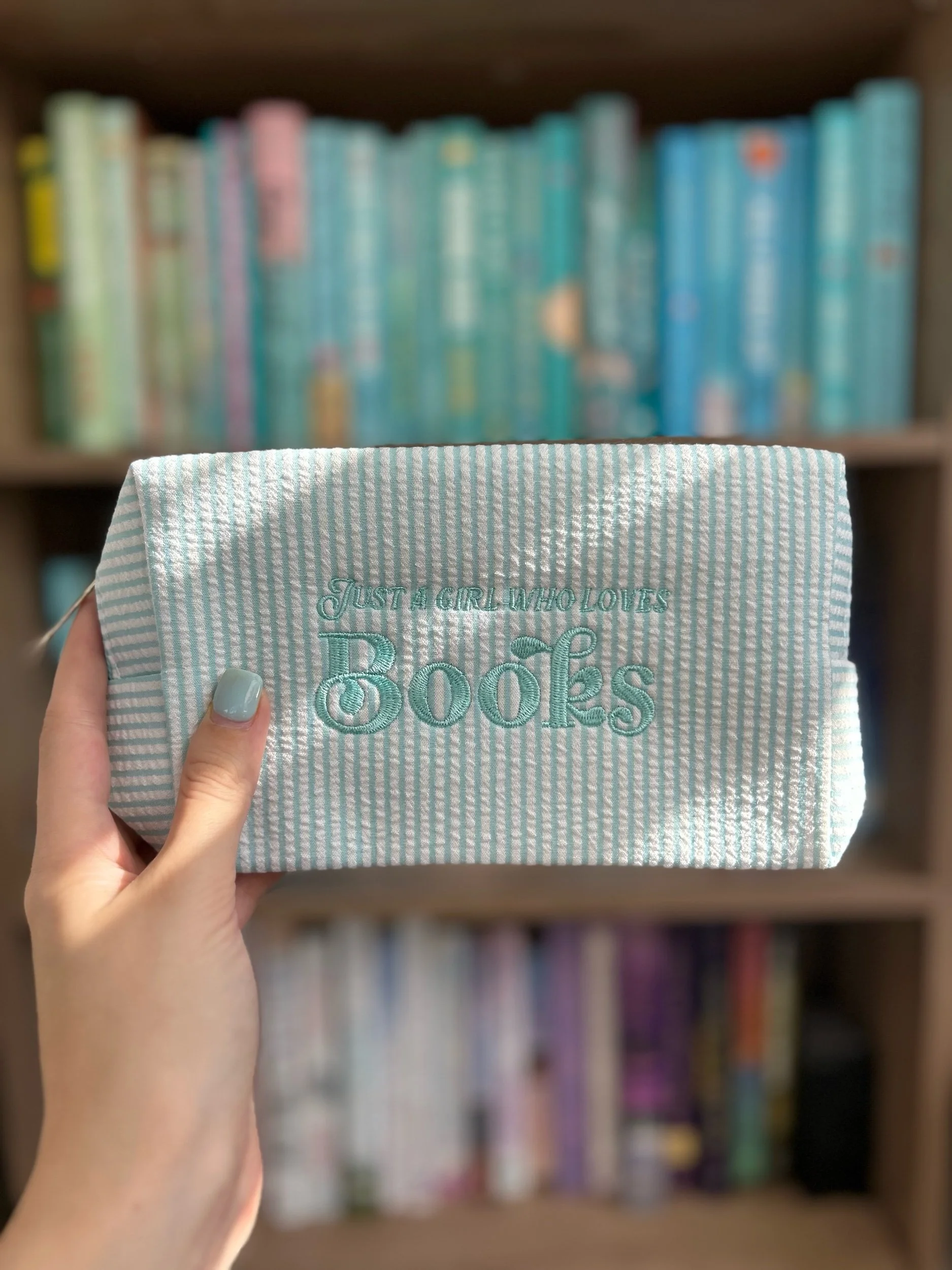 “Just a girl who loves books” cosmetic bag