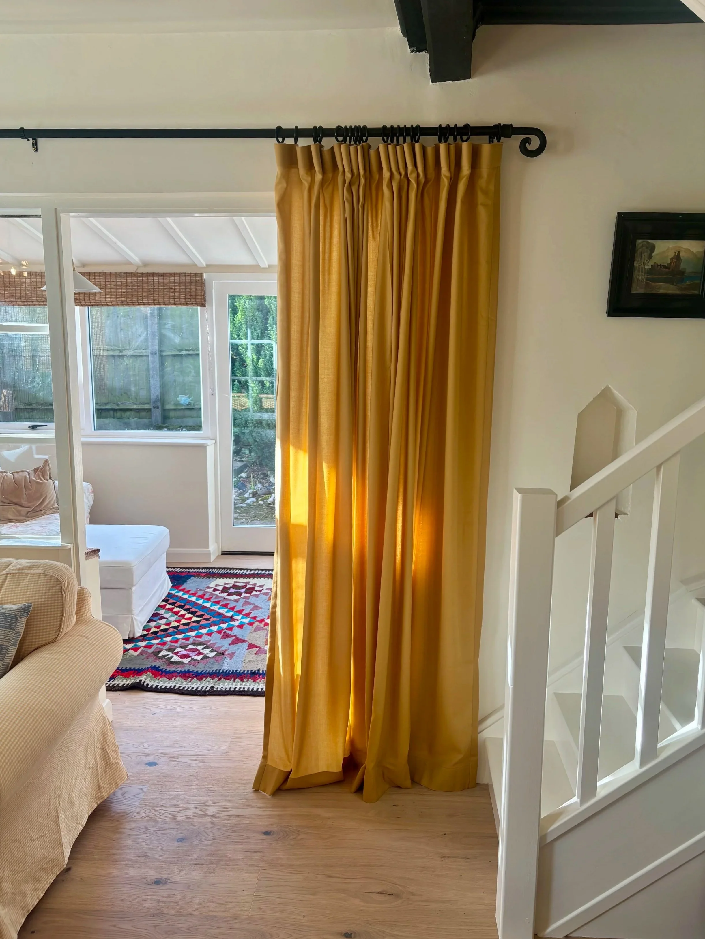 yellow curtains on entrance to sunroom