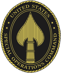 U.S. Special Operations Command emblem featuring a gold spade symbol with a dagger inside, surrounded by the text 'United States Special Operations Command' on a black background.