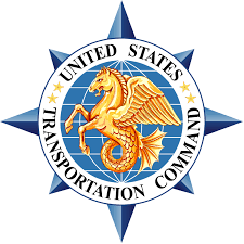 Seal of the United States Transportation Command featuring a golden lion's head, blue starburst, and circular text.