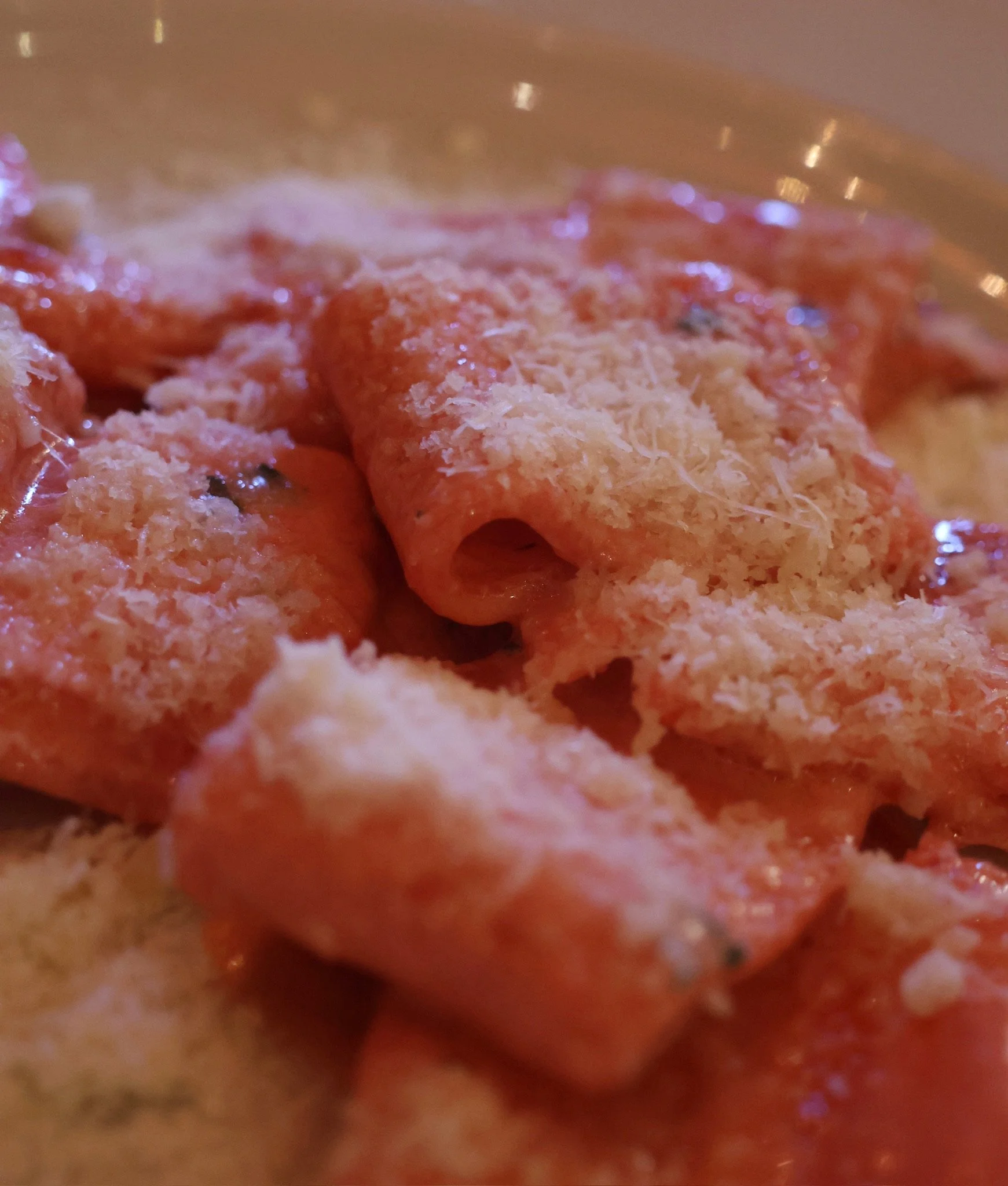 Close-up of a pizza with melted cheese and pepperoni toppings.