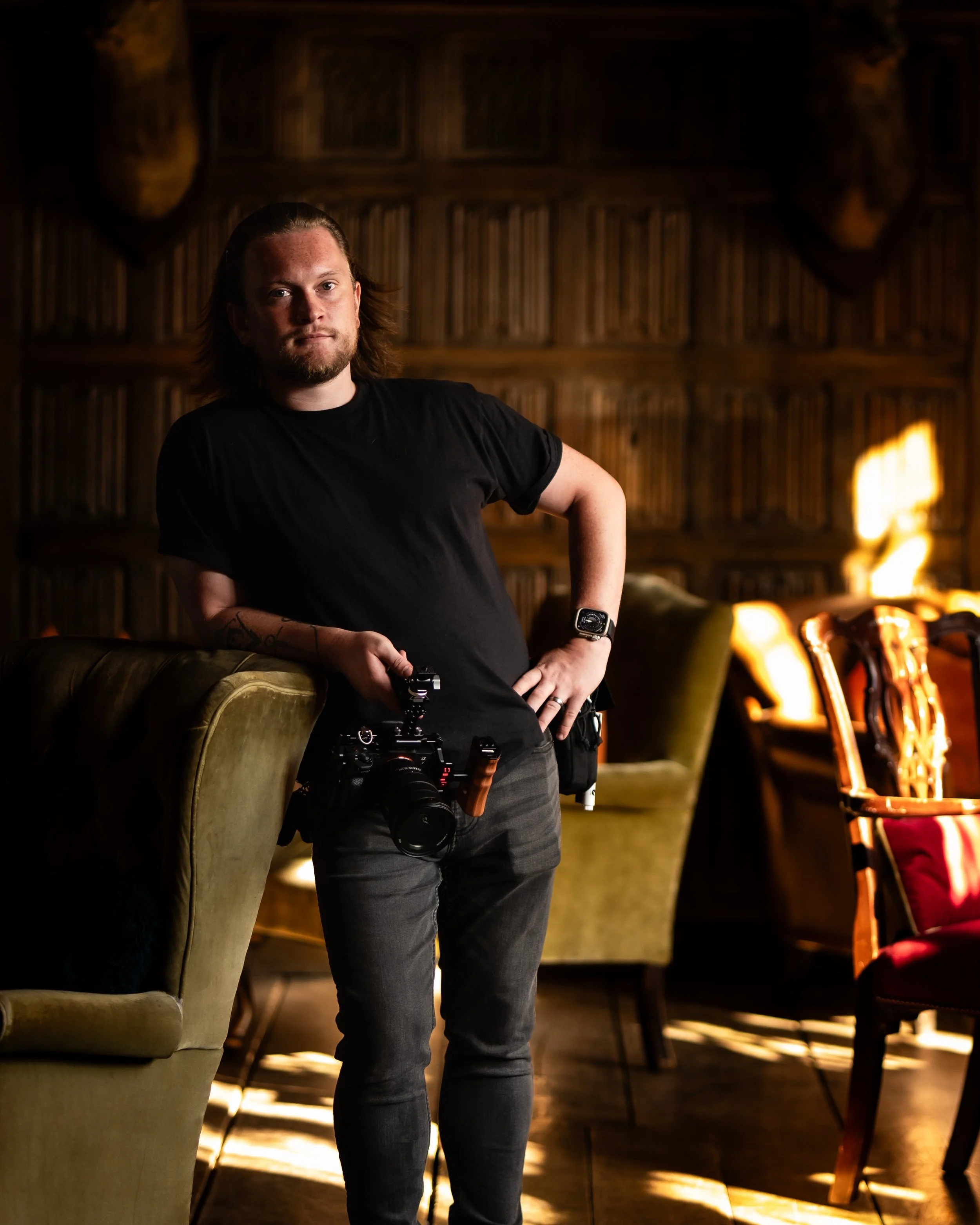 Wedding photographer Joseph McCarthy filming a wedding with a cinema camera during an evening reception in Norfolk.