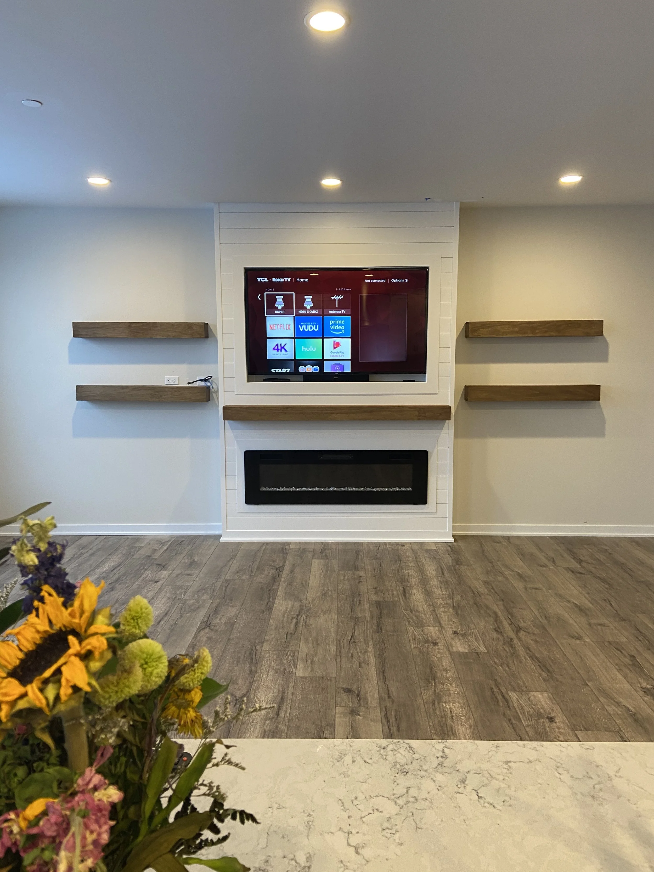 Custom fireplace build , custom shelving , tv mounting
