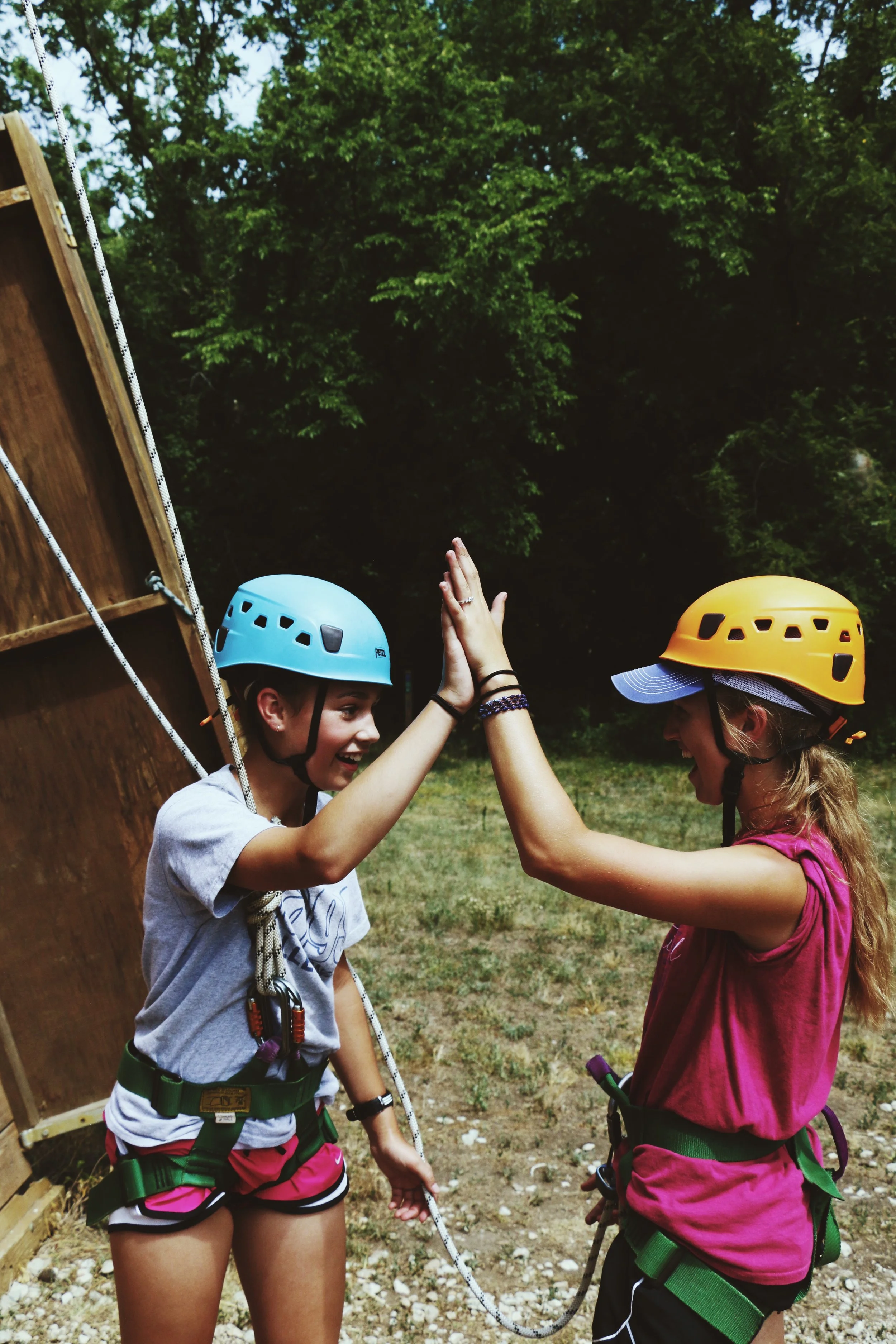 Tower, camper and staff high five.JPG
