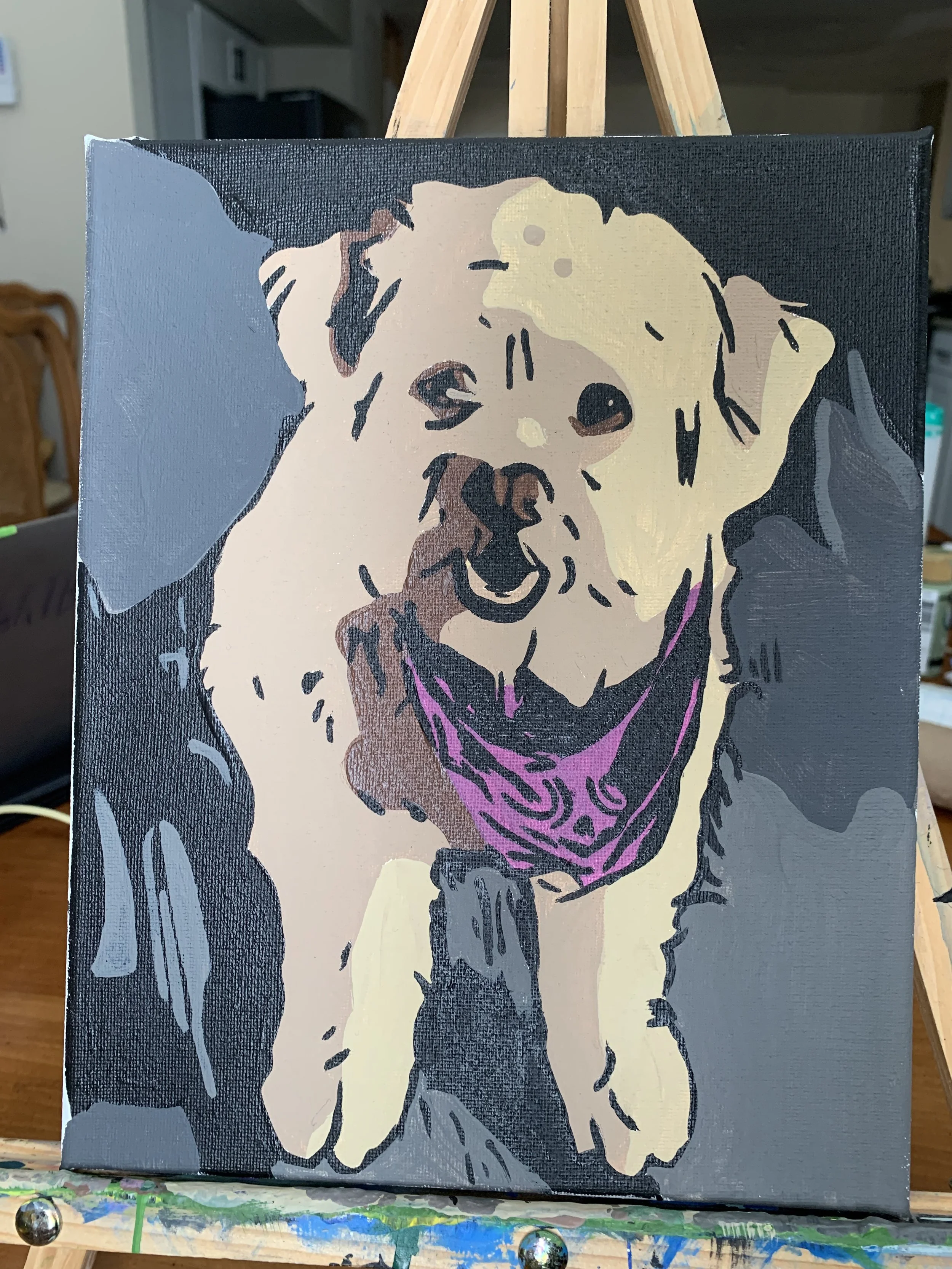 A painting of a smiling dog with a yellow coat, black nose, and pink bandana, depicted in a stylized, abstract manner on a black canvas.