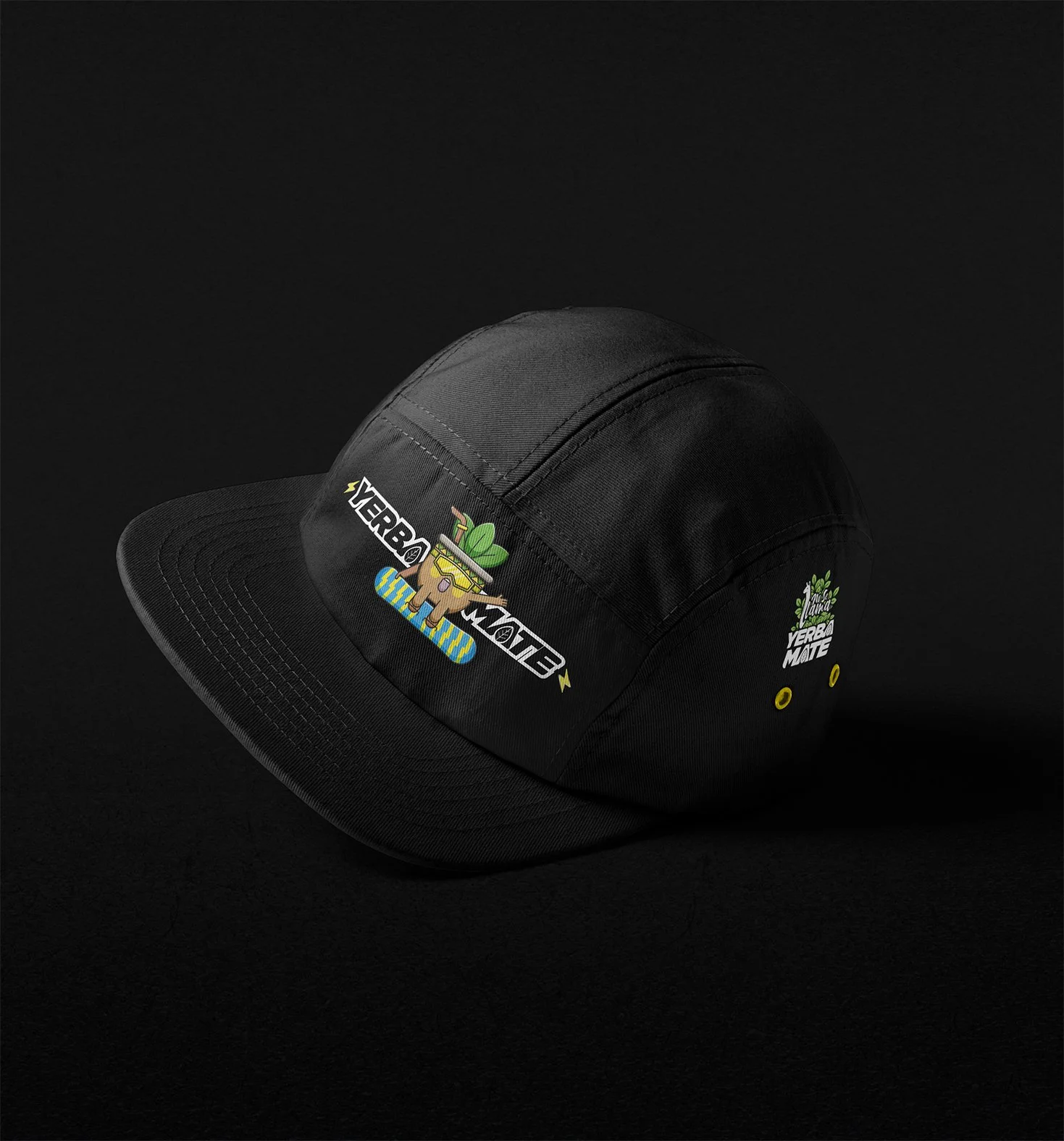 A black baseball cap with colorful patches, including a cartoon dog with sunglasses on a skateboard, the words "Verde Mote," and a small illustration of a plant with the text "Jungle."