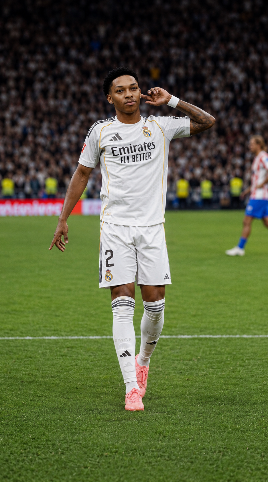 A soccer player wearing a white Real Madrid jersey with the number 2, on a green field during a match, with a crowd in the background.