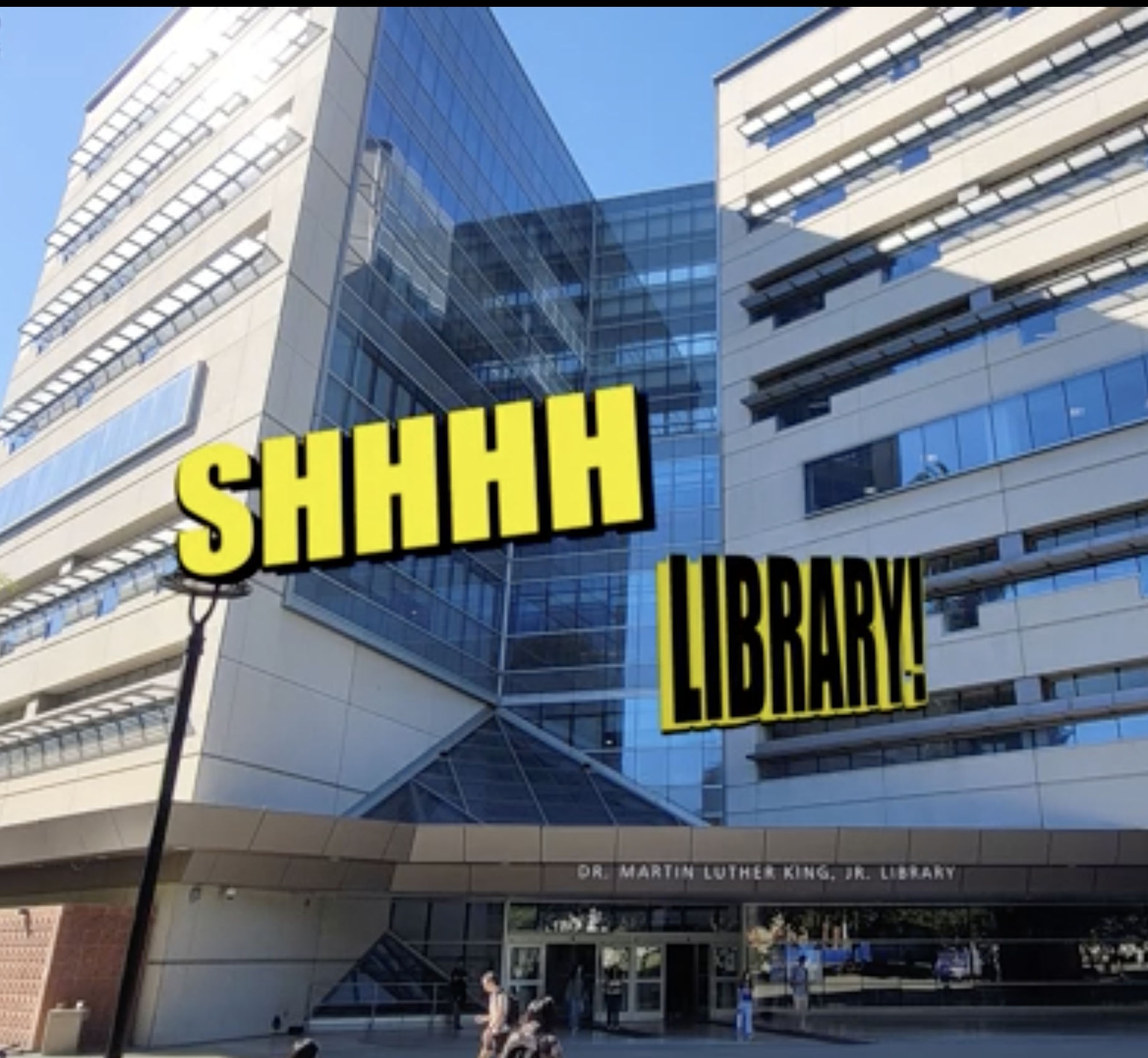 Exterior of a modern multi-story building with glass windows and balconies, with yellow text overlay reading 'SHHHH' and smaller text mentioning Dr. Martin Luther King Jr. Library.