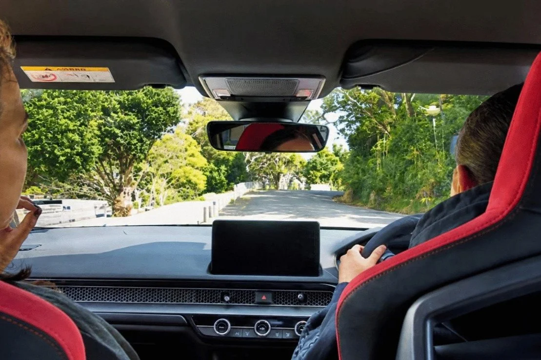 Student Driving during manual driving lesson on a rural road in Northland.