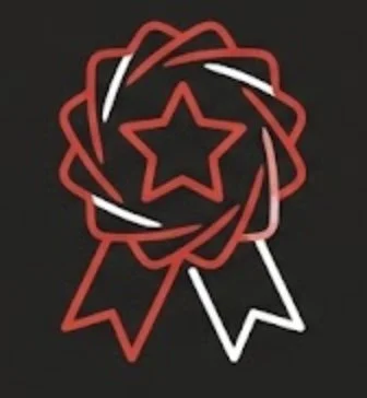 A red and white neon ribbon award featuring a star in the center against a black background.