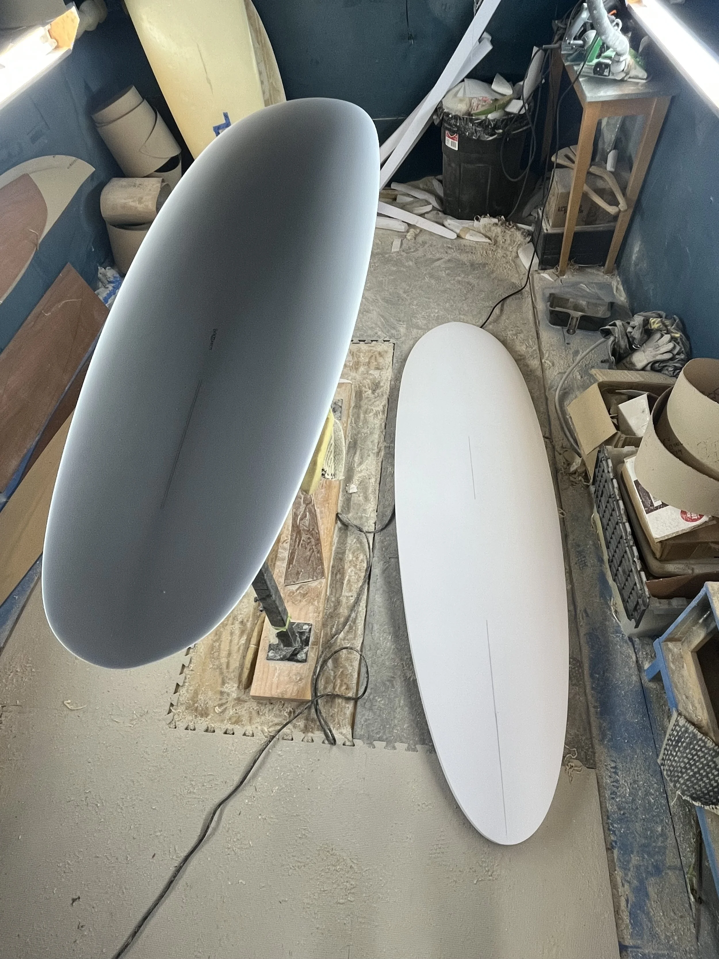 two stringerless displacement hulls shaped by Tim Leckington from lula surfboards at lula surfboards shaping room at shred mfg in torrance california