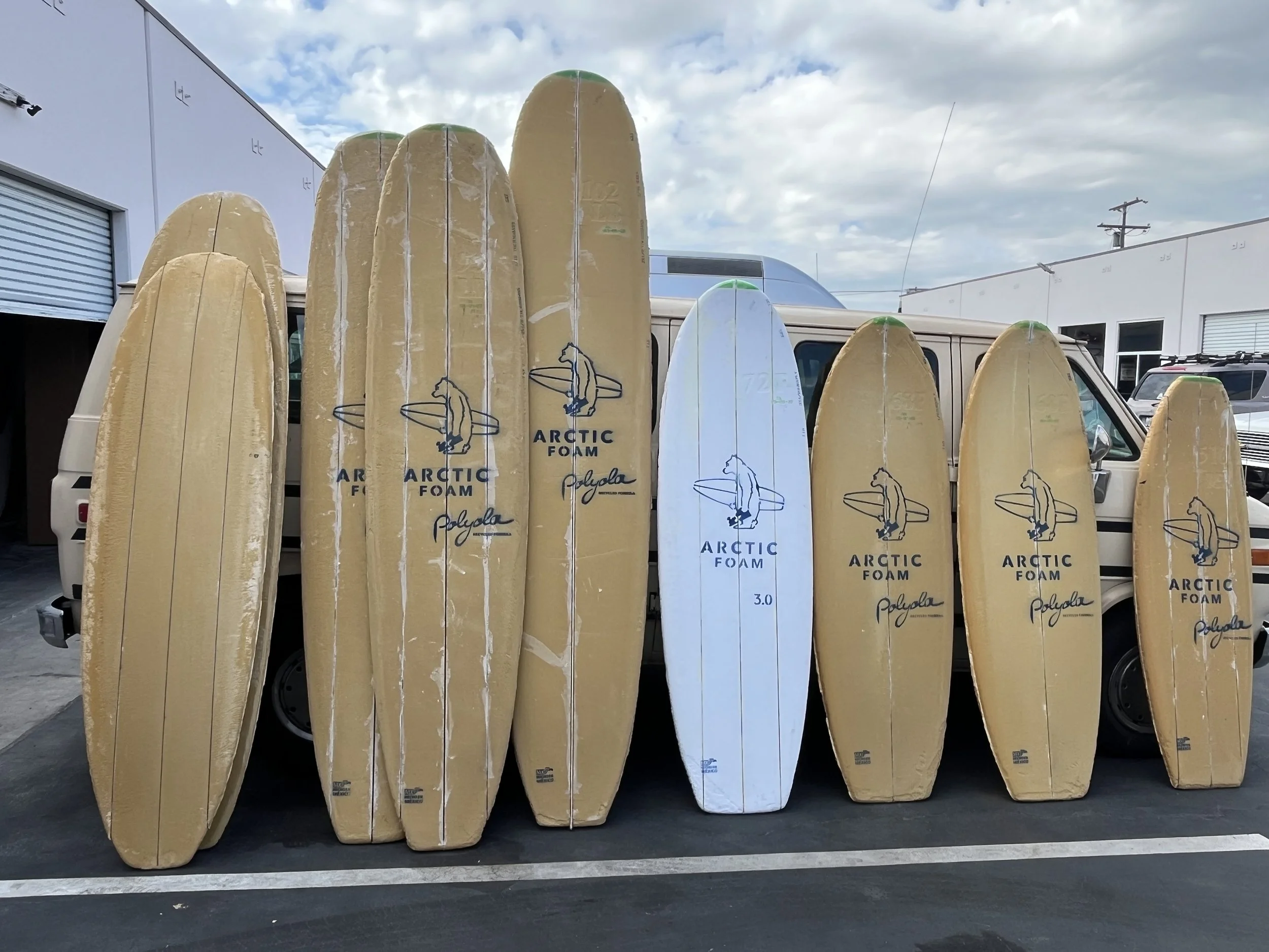Artic foam blanks featuring polyola foam formula stacked against a 1995 Chevy Van at Shred Manufacturing in Torrance California