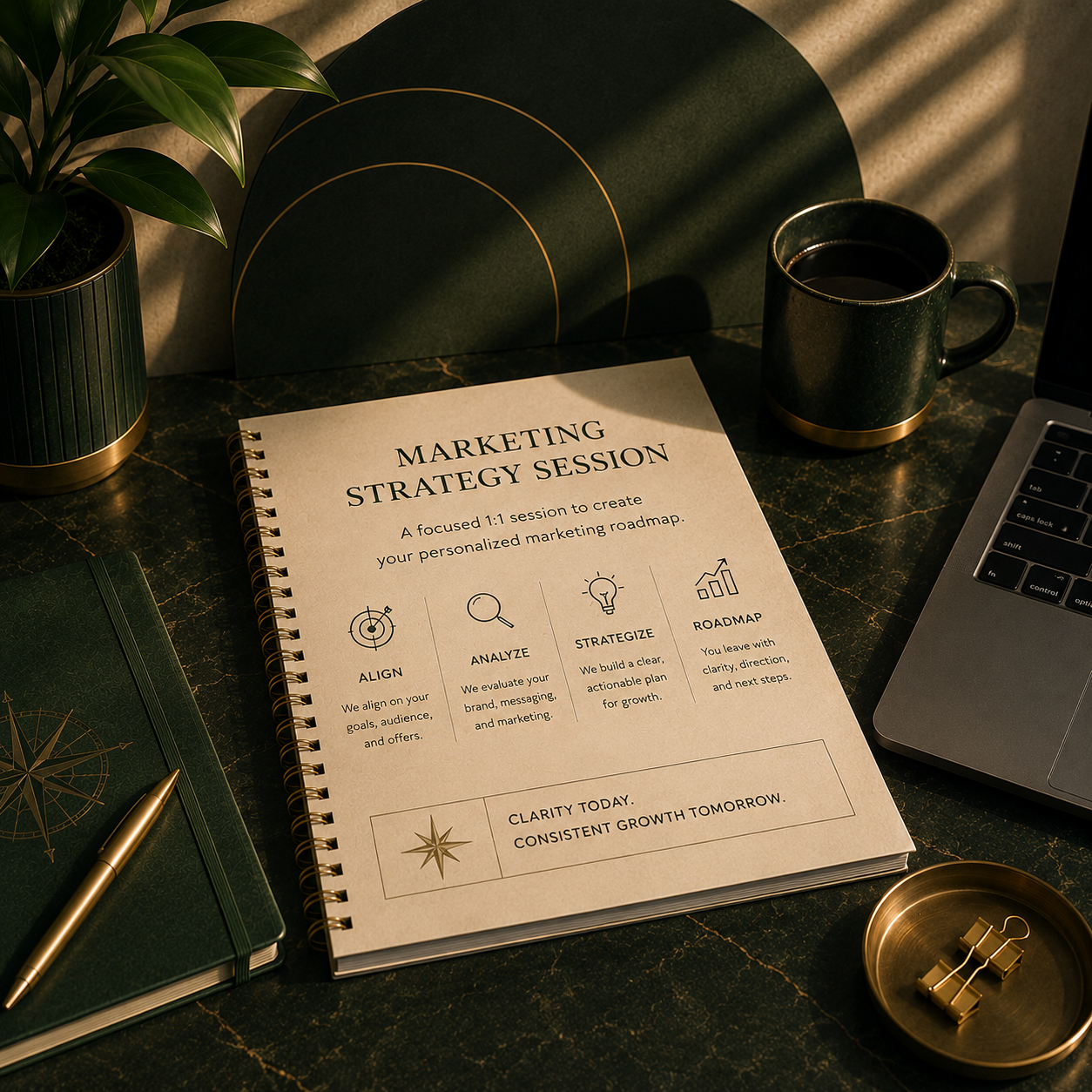 A marketing strategy session planner on a desk with a notebook, a pen, a green plant, a cup of coffee, a laptop, and a decorative box. The planner includes steps to align, analyze, strategize, and roadmap marketing plans.