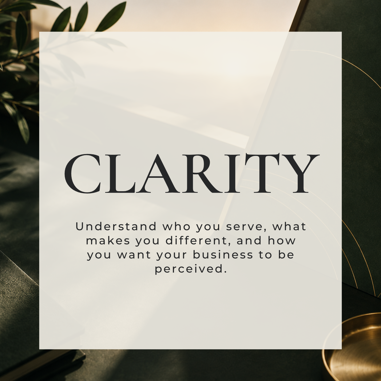A blurred background of a closed white laptop, green leaves, and gold decor, with a white semi-transparent overlay containing the word 'CLARITY' in large black letters and a subtitle about understanding and perception