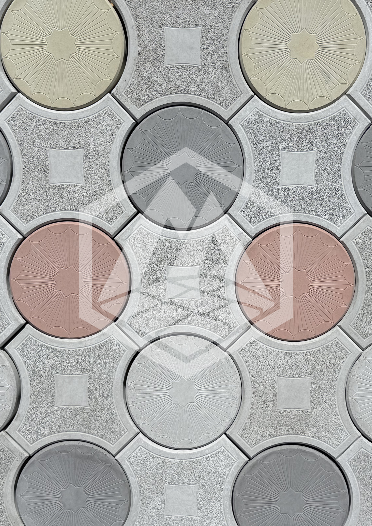 Photo of decorative ceiling tiles featuring a floral and geometric pattern in shades of white, pink, gray, and beige.