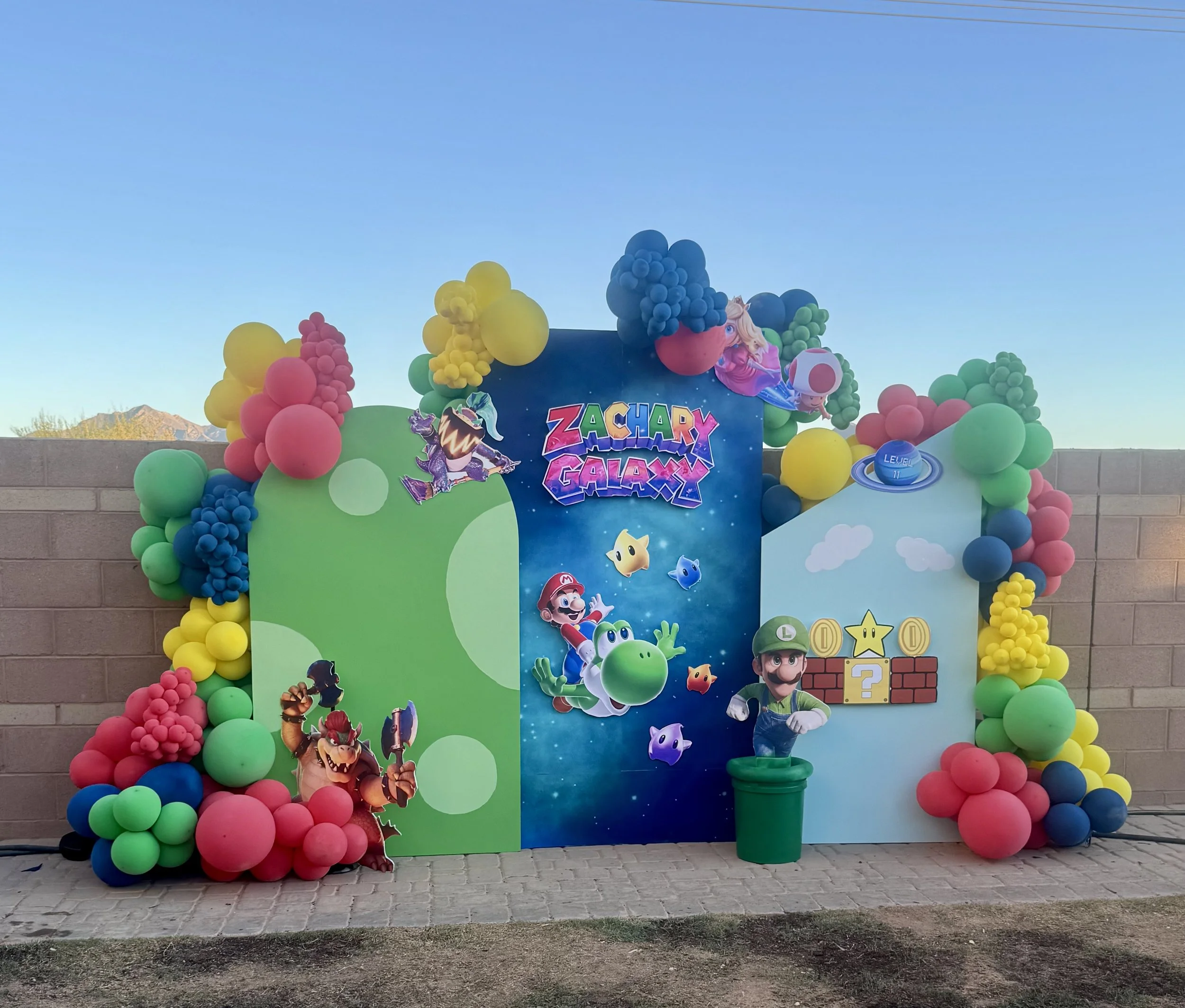 SuperMario Galaxy themed focal point featuring Mario, Luigi, Princess Peach, Toad, Bowser, & Bowser Jr