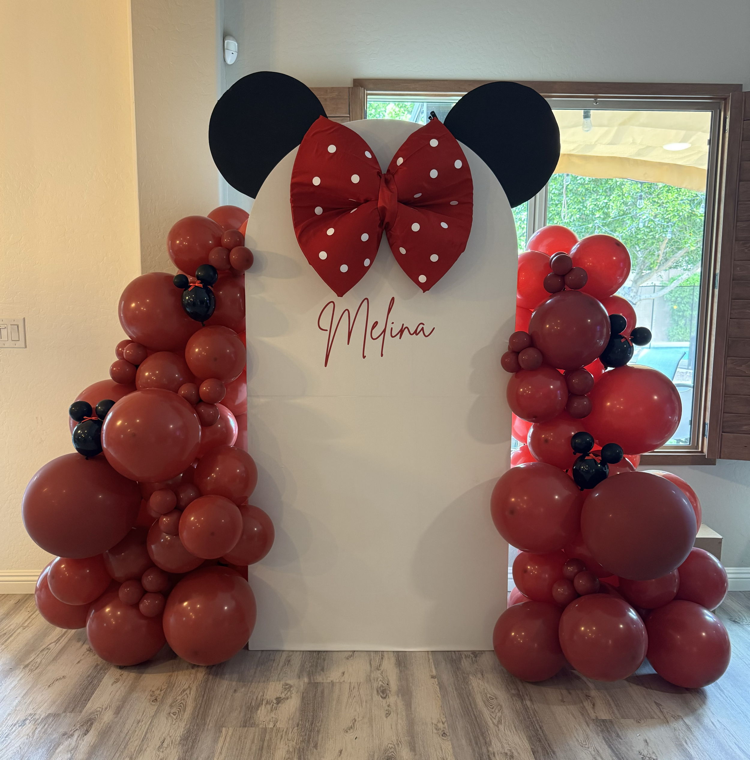 Minnie Mouse custom bow, ears, and Minnie head balloons were perfect for this Birthday party