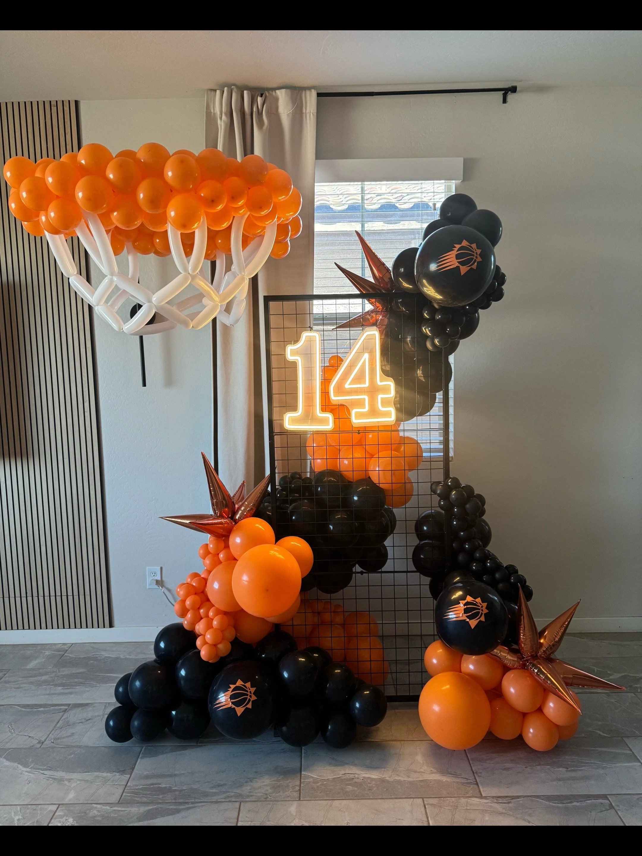 A Slam Dunk Birthday celebration for the Basketball obsessed teenager! Featuring our grid wall backdrop, LED number light, Balloon-Basketball hoop sculpture, and Phoenix Suns Balloon colors!