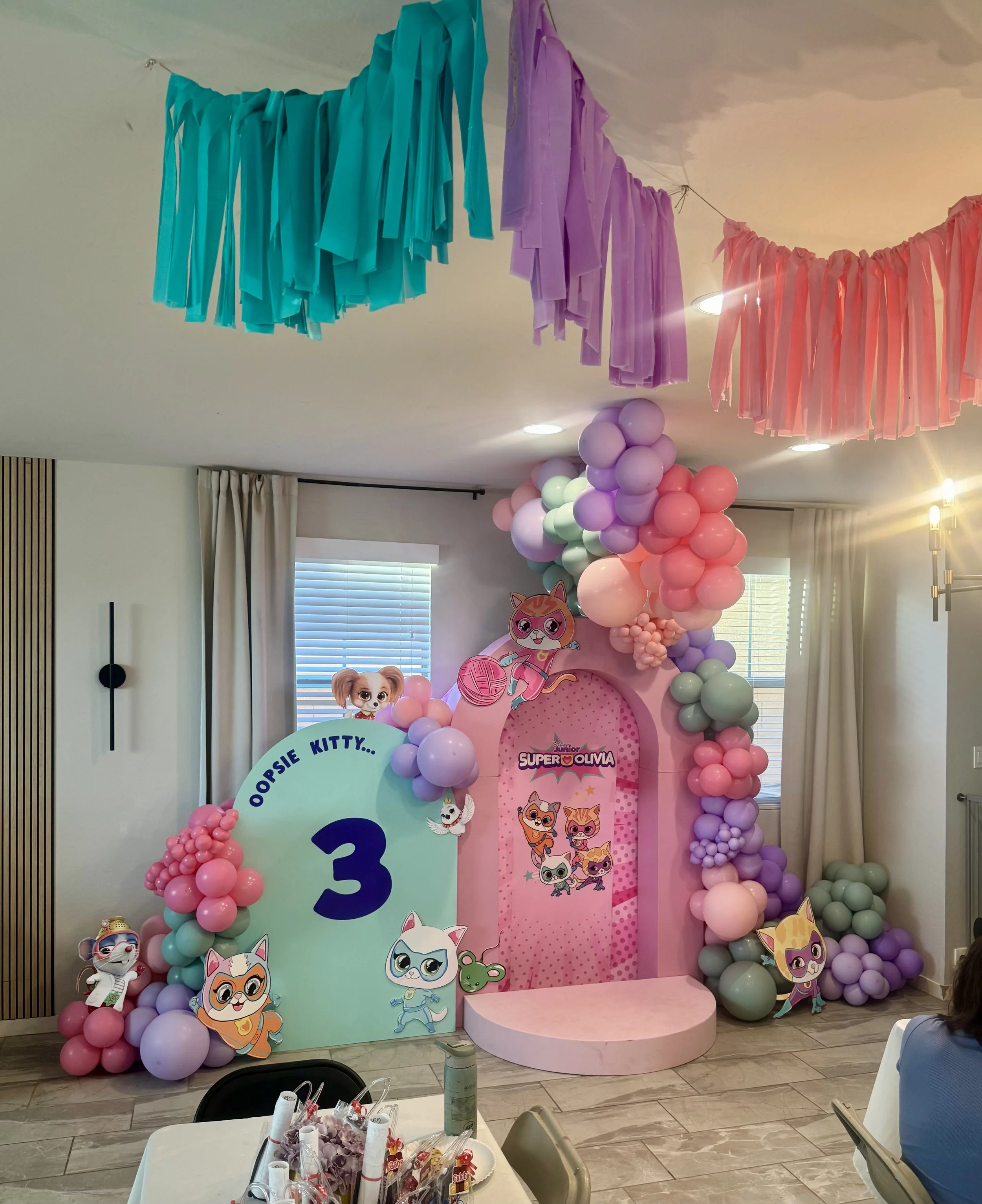 Disney's SuperKitties themed setup featuring pastel balloon colors, 3D Arch, and an elevated stage. Perfect for a kitty cat-loving birthday girl!