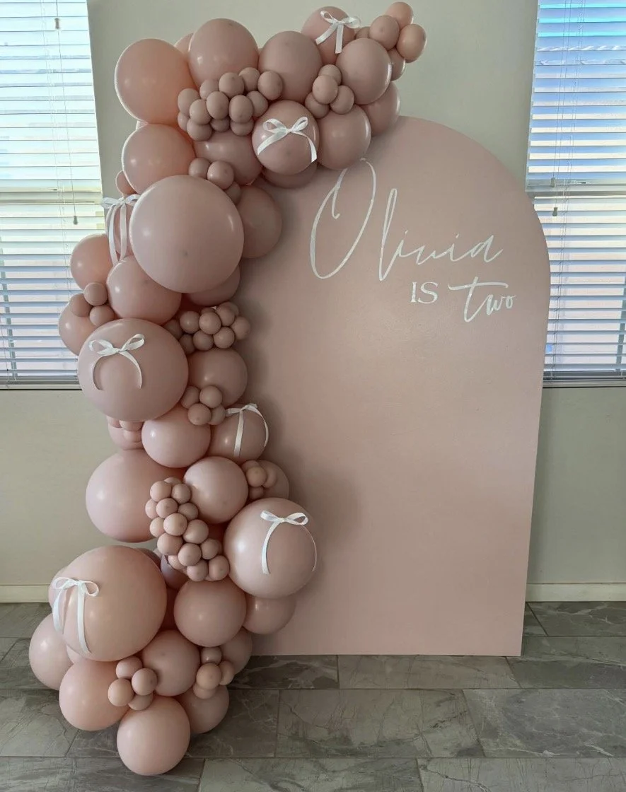 Pink Monochrome Birthday Balloons and Backdrop. Featuring white bow accents and Kalisan Blush Pink Balloons