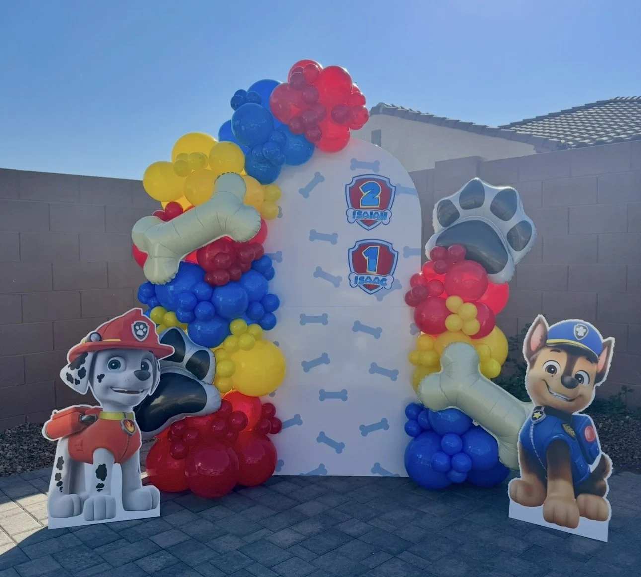 Paw Patrol Birthday Party featuring custom printed backdrop, Marshall & Chase standing props & matching balloon colors