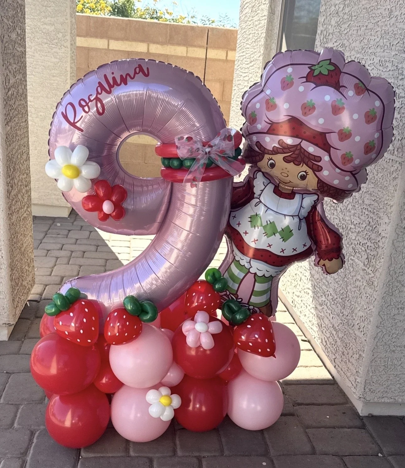 Strawberry Shortcake theme Balloon Stack featuring Strawberry Shortcake foil, balloon strawberries & flowers 