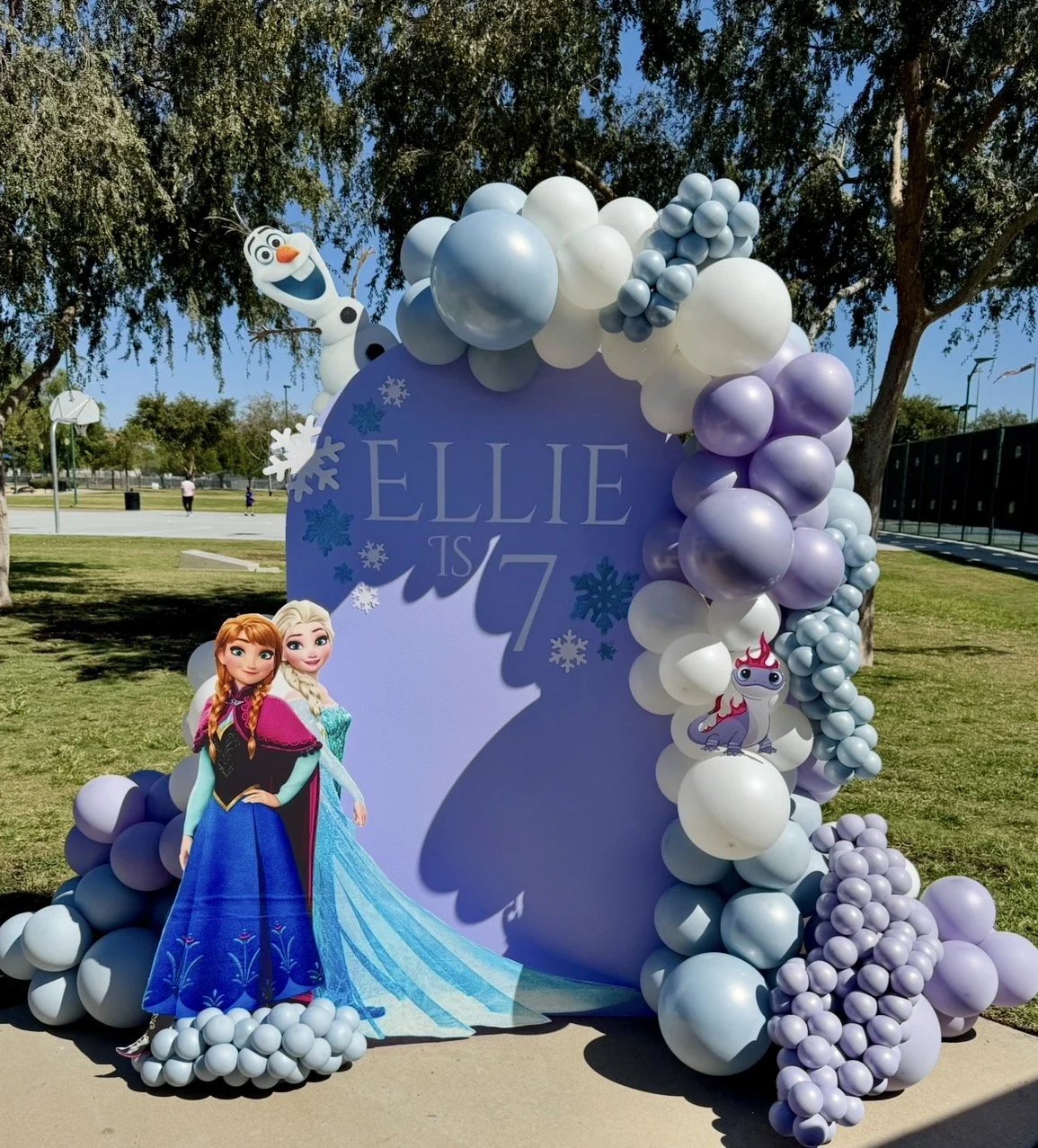Frozen Birthday party setup including Olaf, Elsa, and Anna. Ice Blue, Ivory White, and Lavender Fog Balloons from Kalisan's Aura Collection