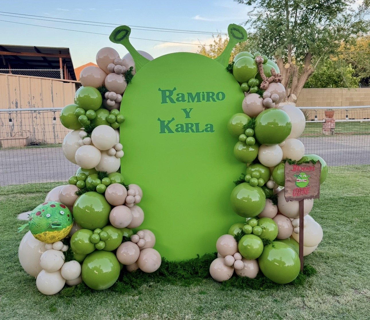 Shrek themed birthday celebration. Fun details included the Shrek ogre ears, Beware Ogre sign, and paper mache frog & snake props 