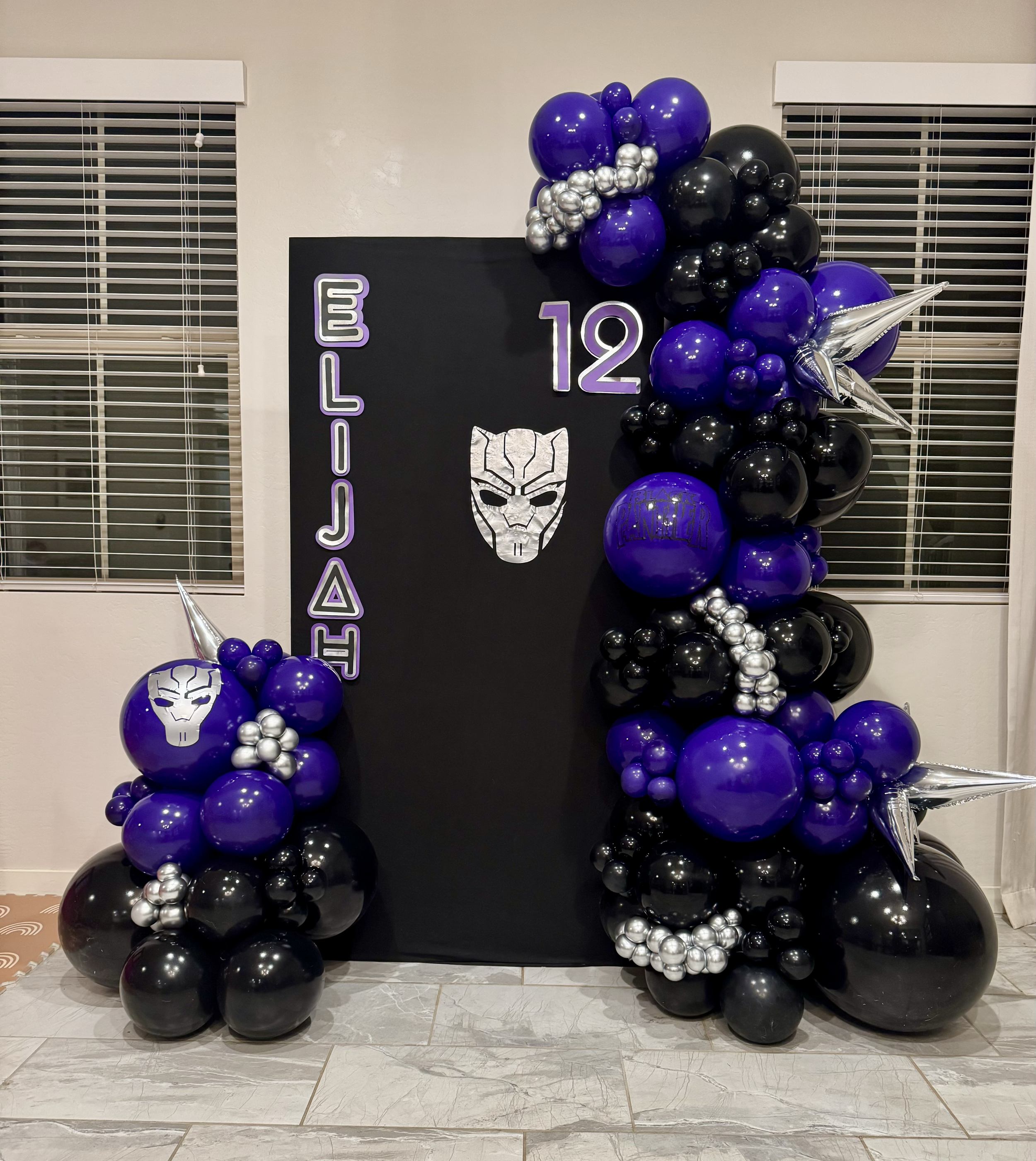 Wakanda Forever! Marvel Black Panther backdrop & black and purple balloons to celebrate Eli's Birthday
