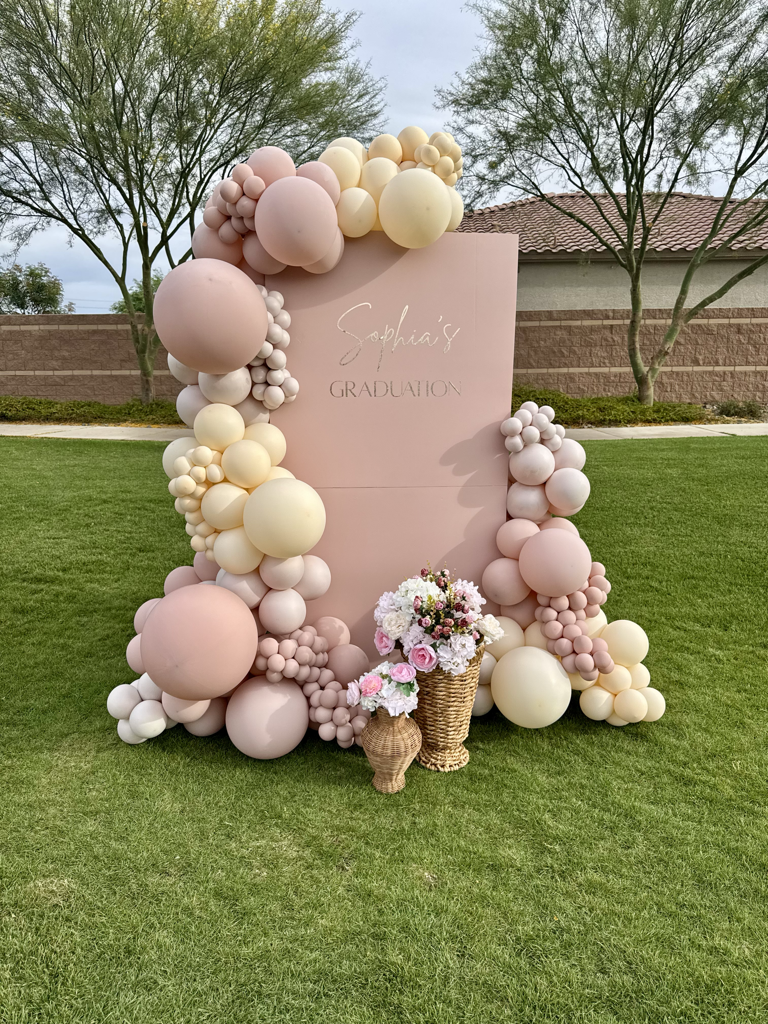Blush Pink & Cream Balloon Garland and Backdrop with coordinating floral arrangements