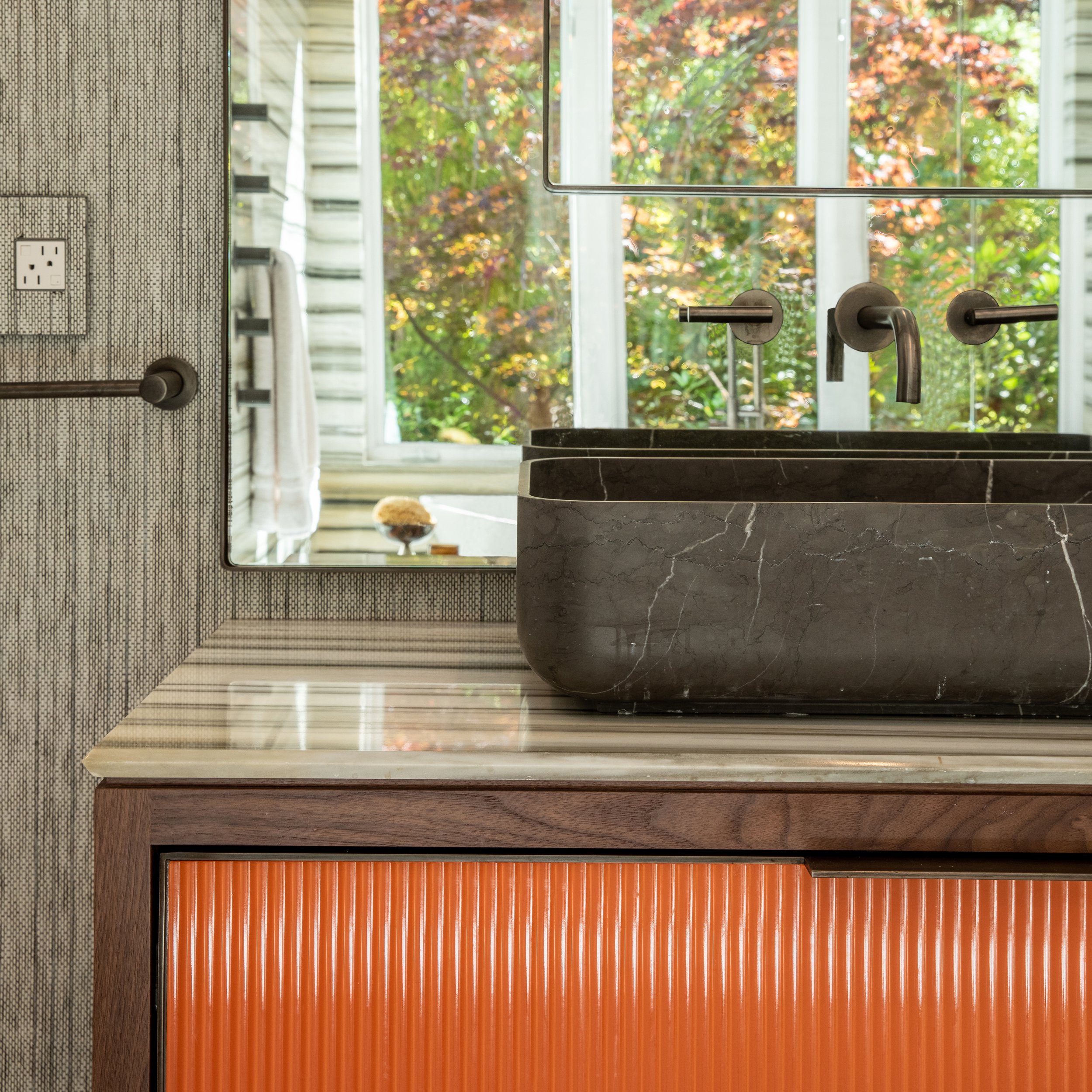 Various samples of wood veneer options, including oak, walnut, and cherry, displayed with textured surfaces and hardware.
