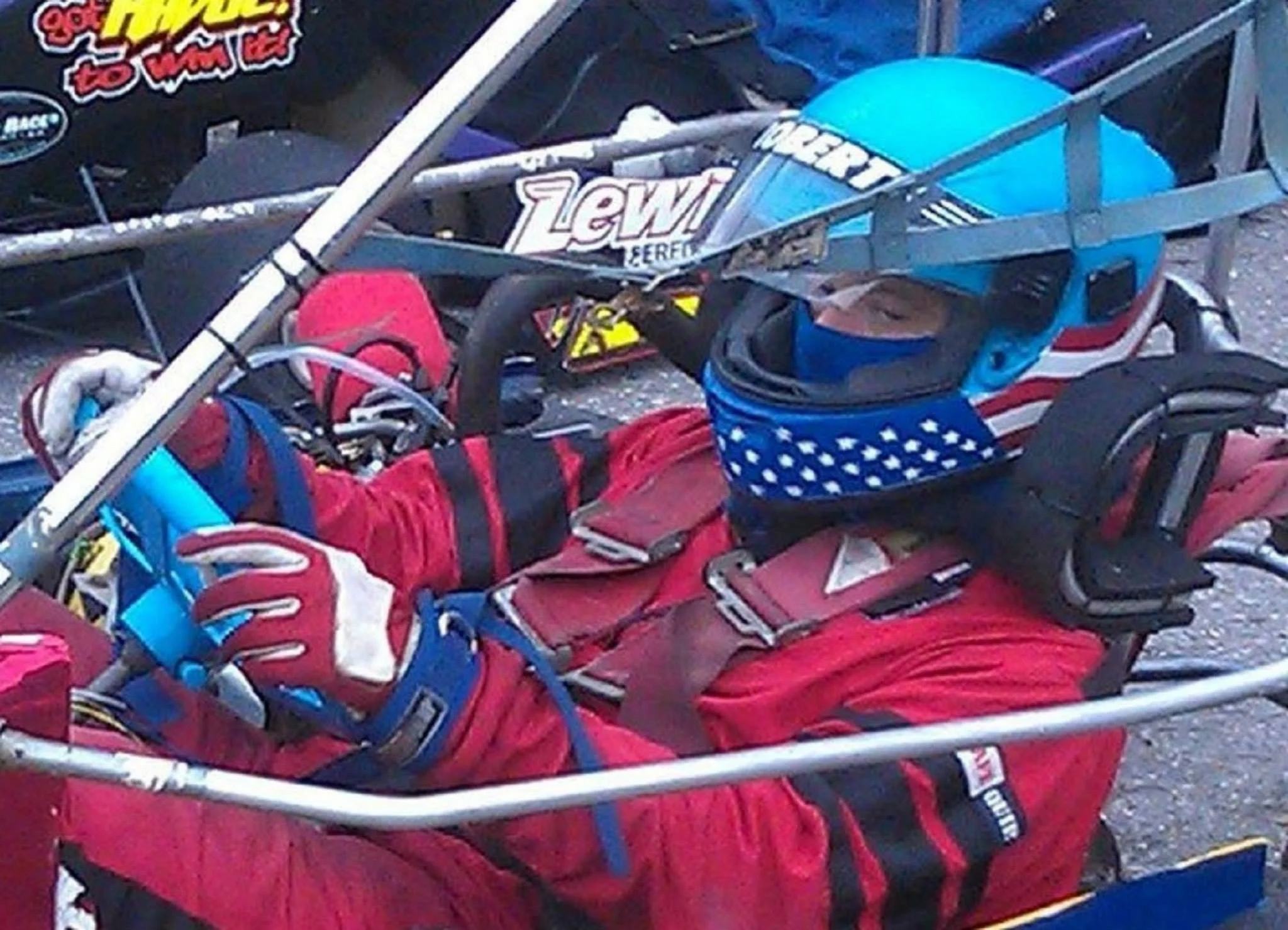 race car driver sits in his champkart