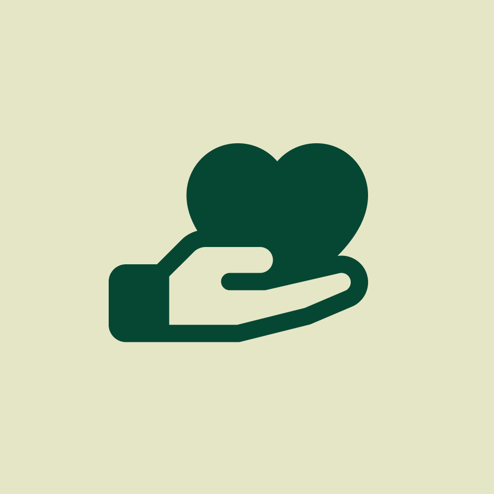 A dark green hand holding a heart-shaped object on a light background.