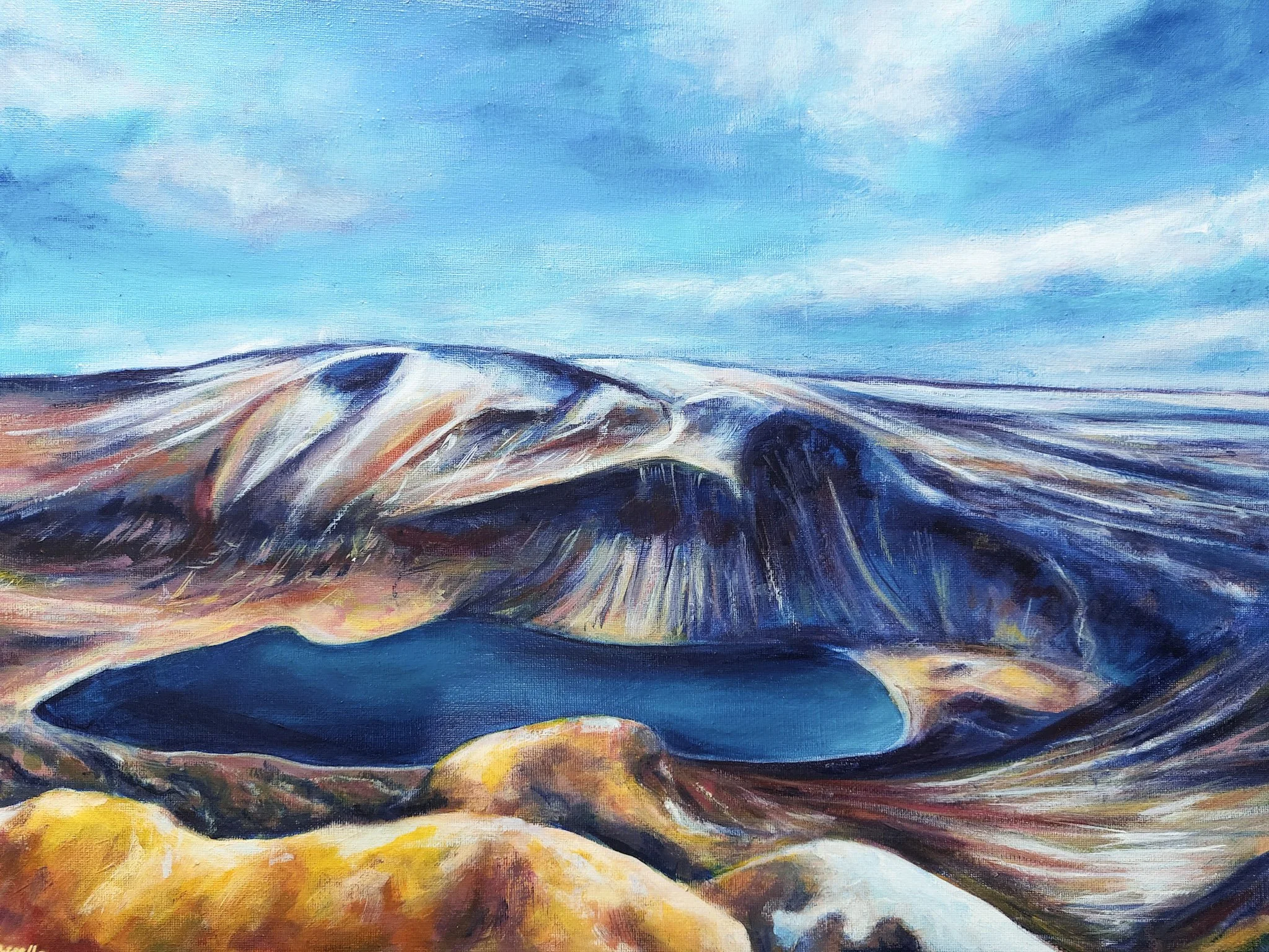 An abstract painting of a mountain landscape with a blue sky, white clouds, and multicolored mountain slopes