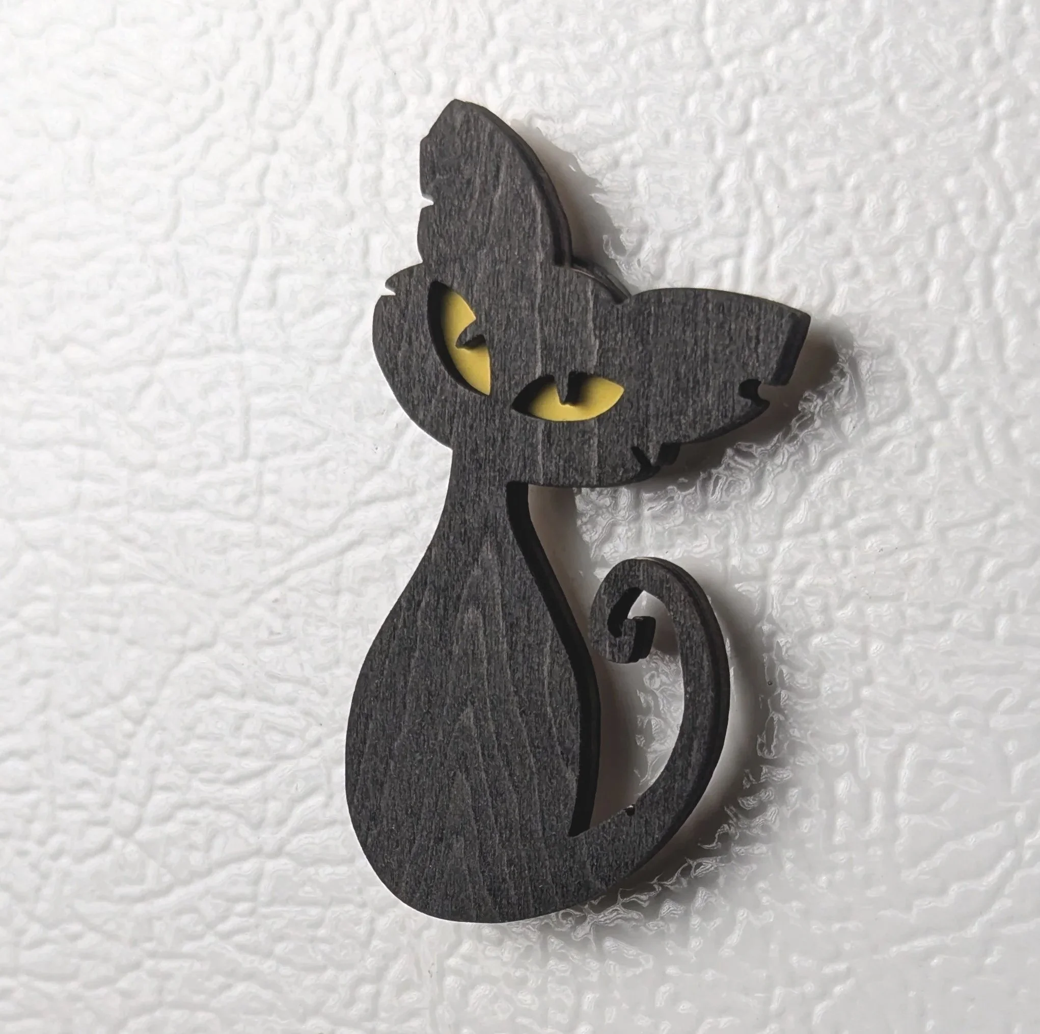 Cat-Curled-Tail-on-Fridge.jpg