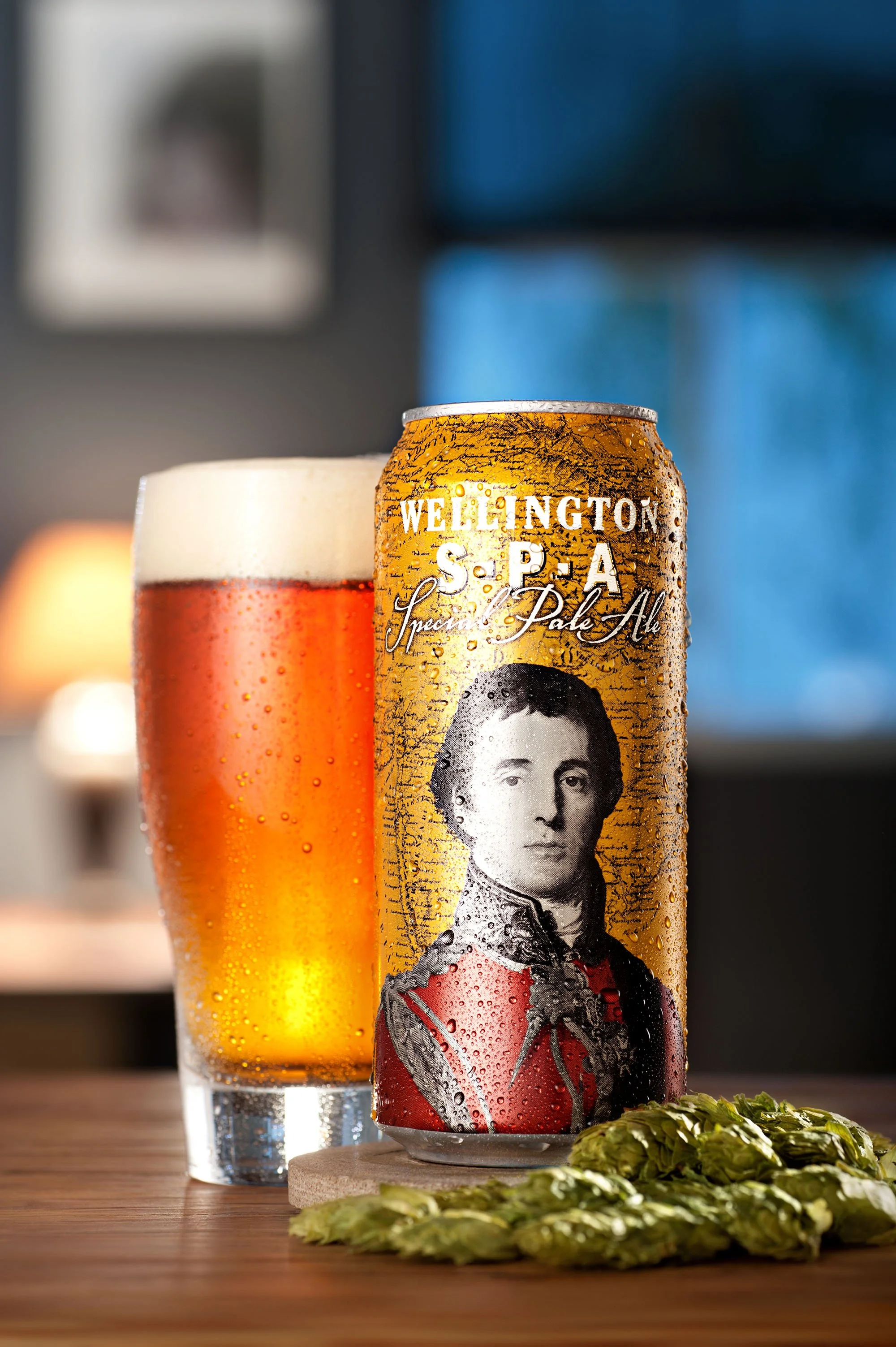 Wellington S.P.A. specialty pale ale with a vintage-style label beside a glass of beer.