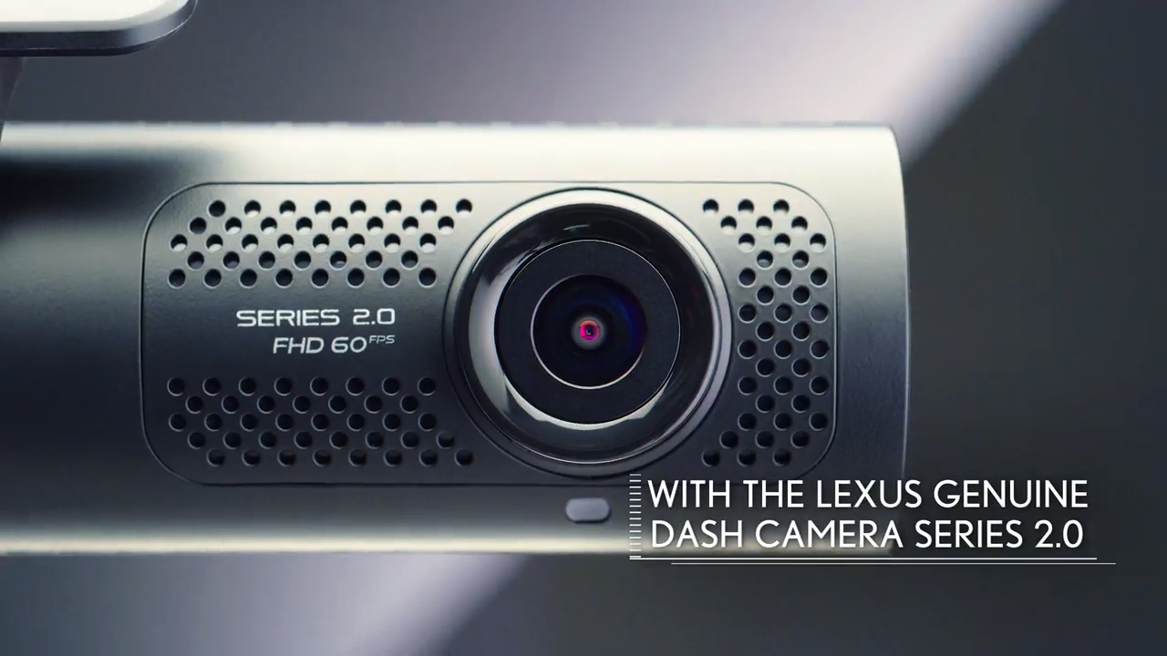 Close-up of a Lexus Genuine Dash Camera Series 2.0 attached to a vehicle dashboard.