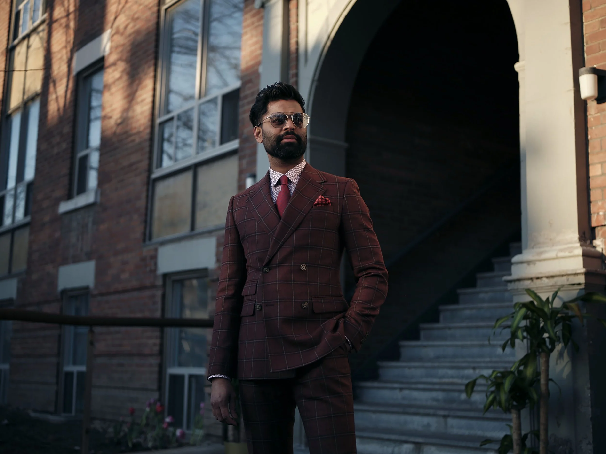 Commercial lifestyle photography featuring tailored menswear for the Indochino advertising campaign in an urban environment.