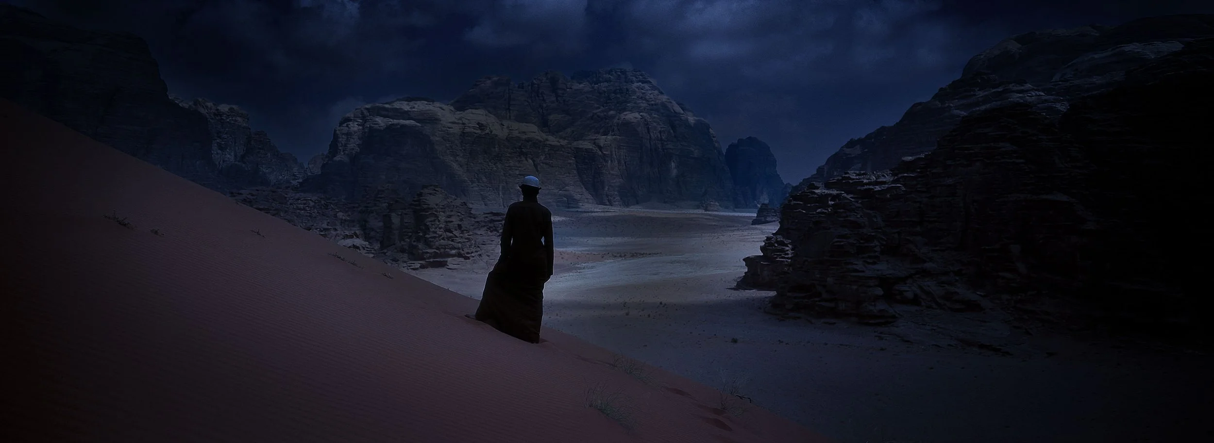Cinematic landscape photograph of a woman in the desert of Wadi Rum, Jordan